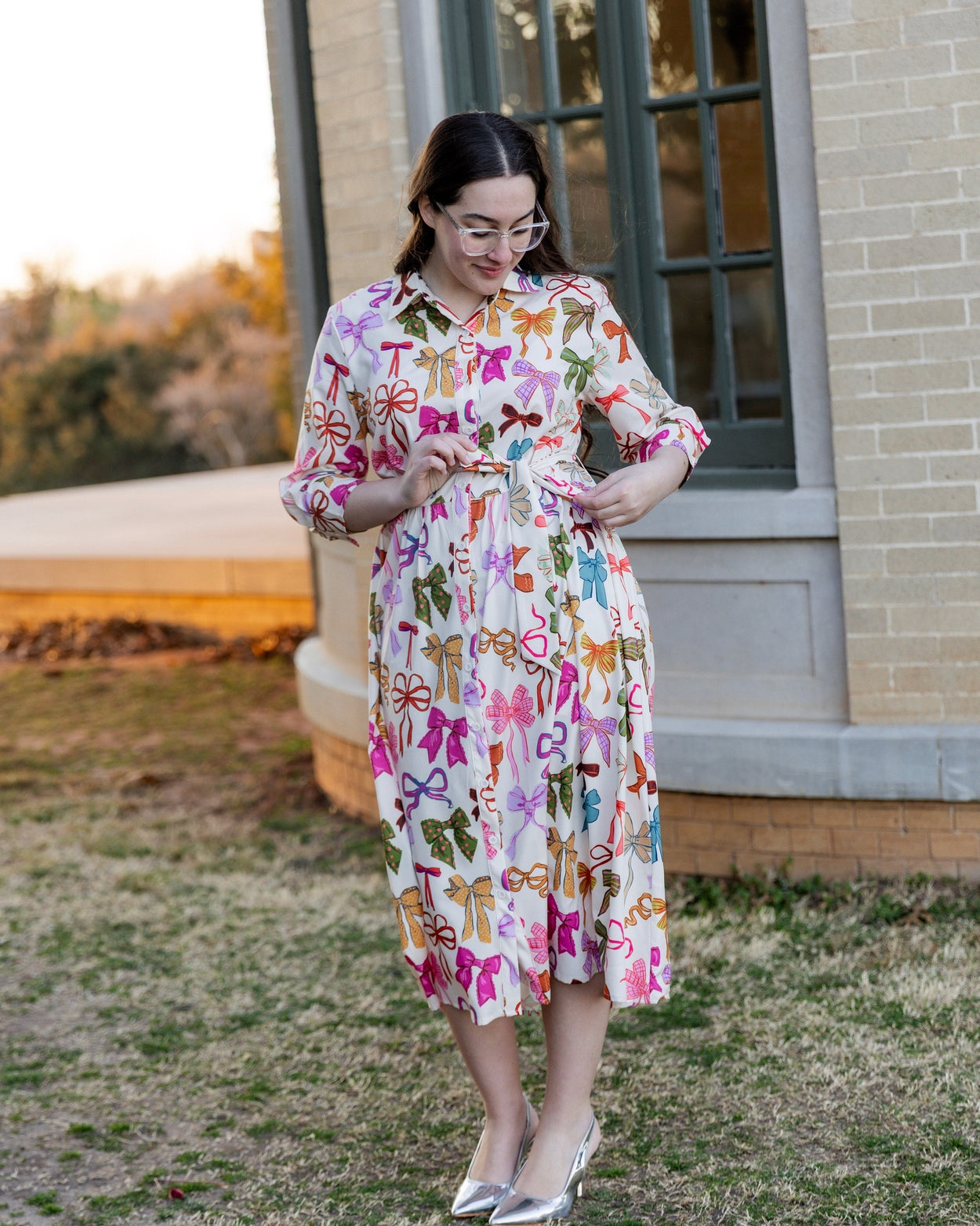 Model wearing the Nuggles® Rachel Dress in Bow Garden