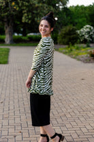 Model wearing the Avery Top, featuring modest 3/4 sleeves and a flowy, flattering fit.