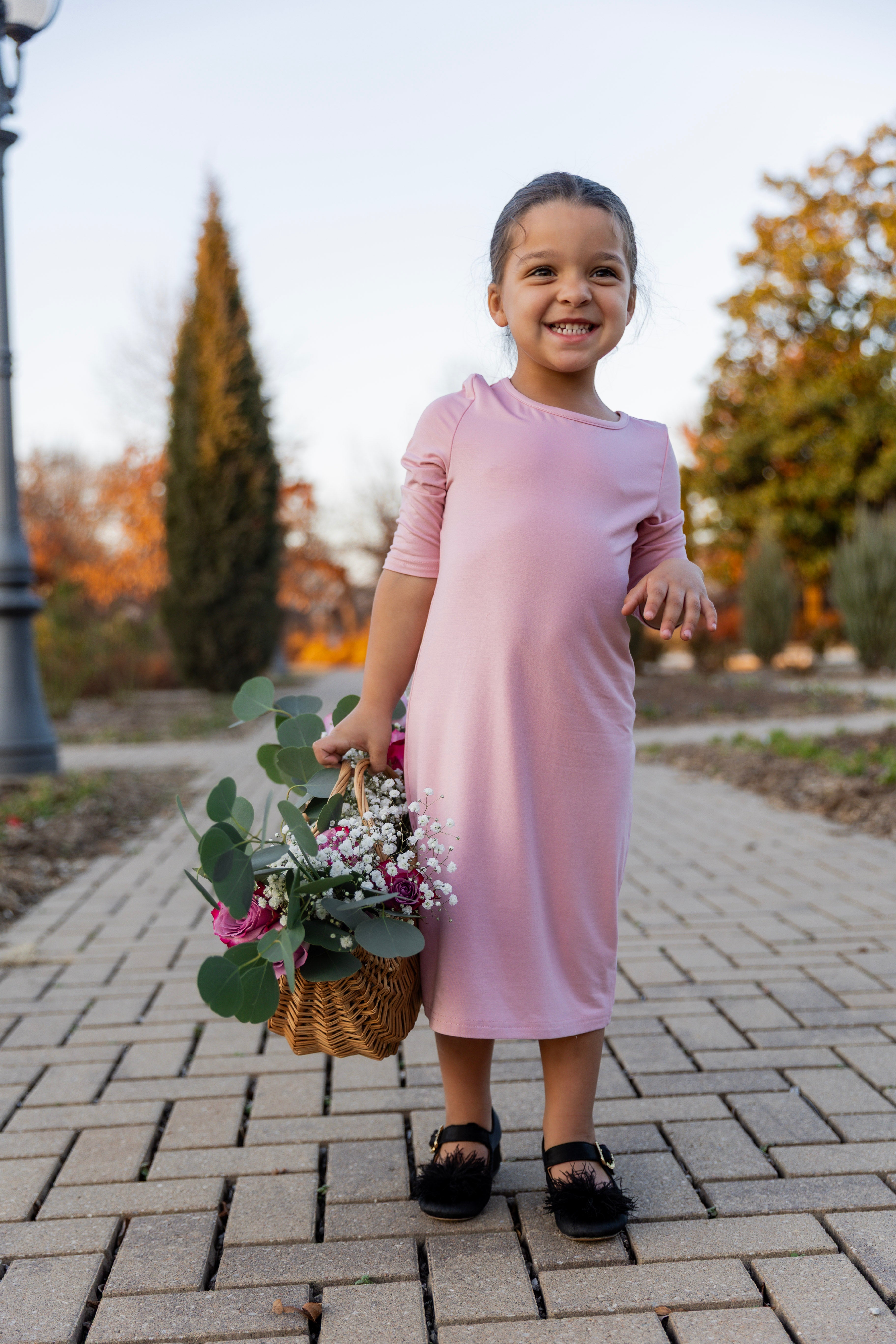 Model wearing our Nuggles® girls midi layering dress
