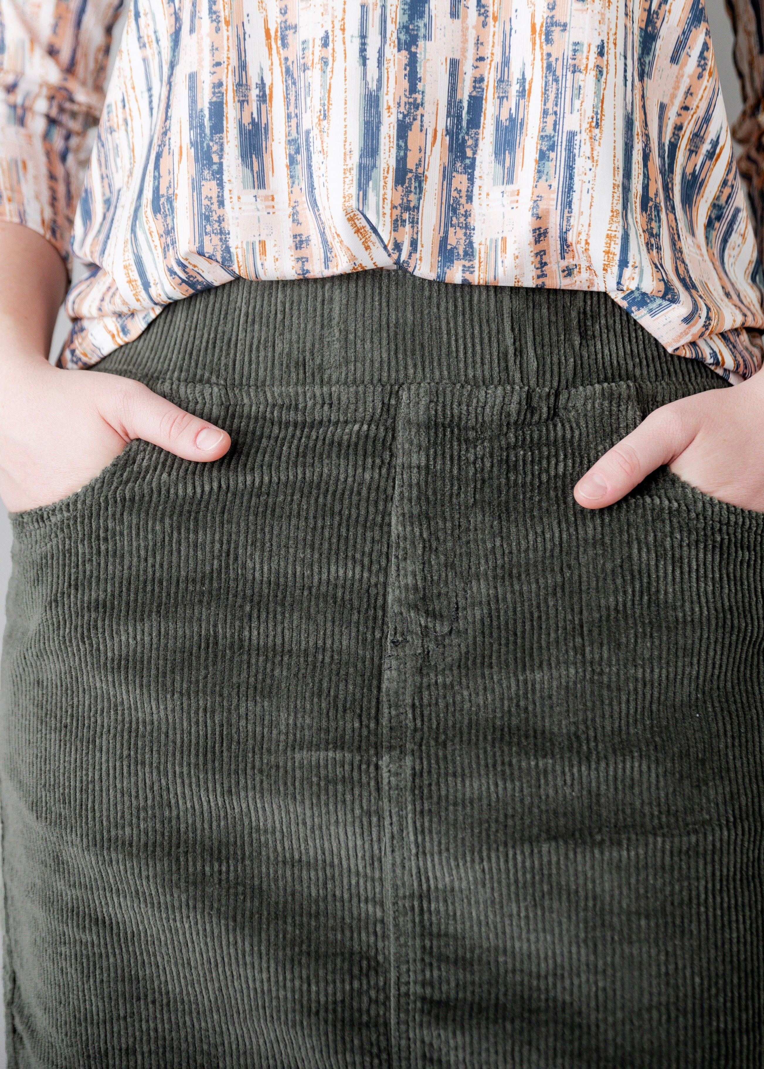 Model wearing Nuggles® 27-inch corduroy skirt