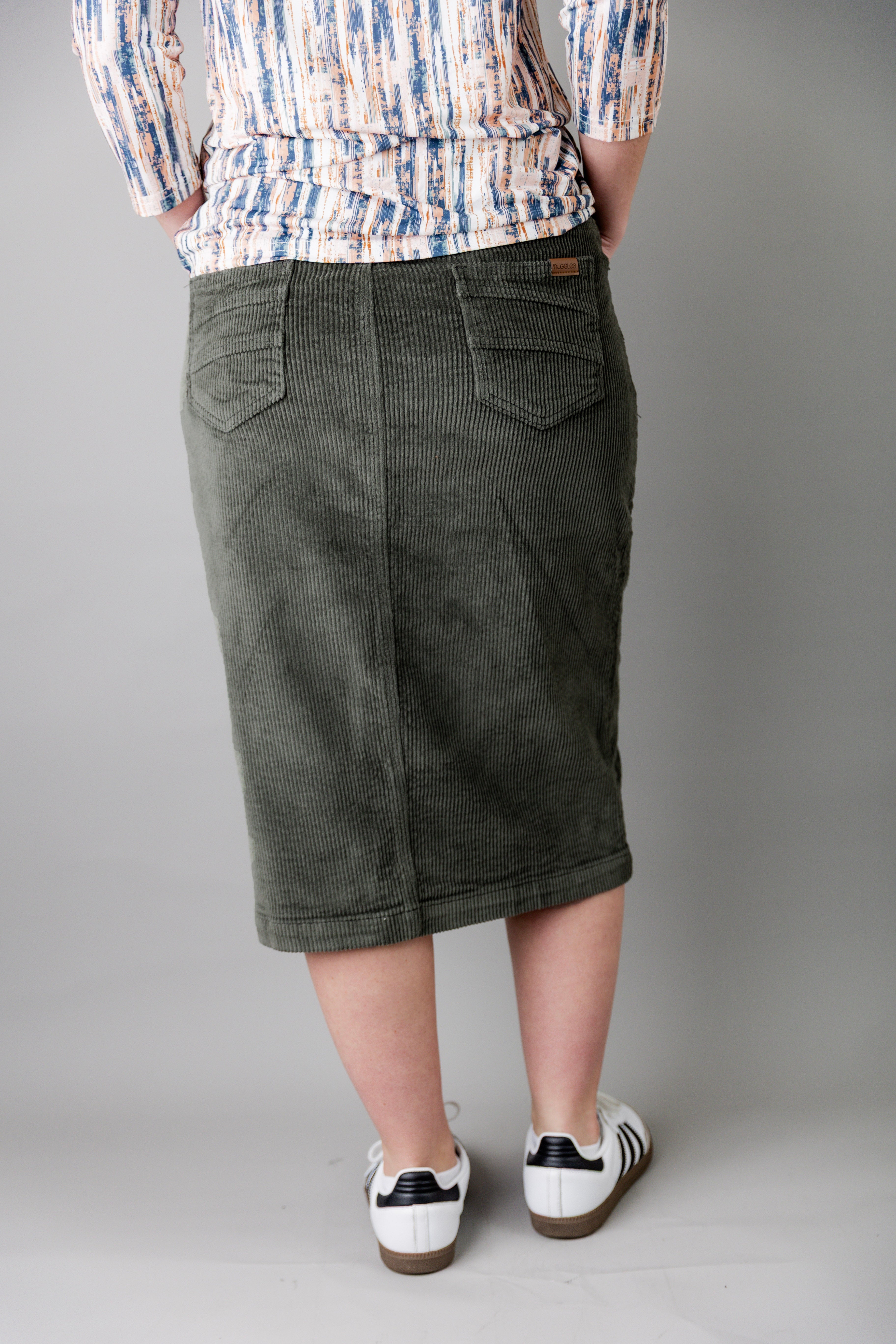 Model wearing Nuggles® 27-inch corduroy skirt