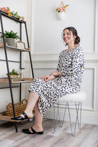 Modest dolman sleeve dress for women with relaxed fit and tapered hem, made from soft stretch knit fabric – perfect for everyday wear.