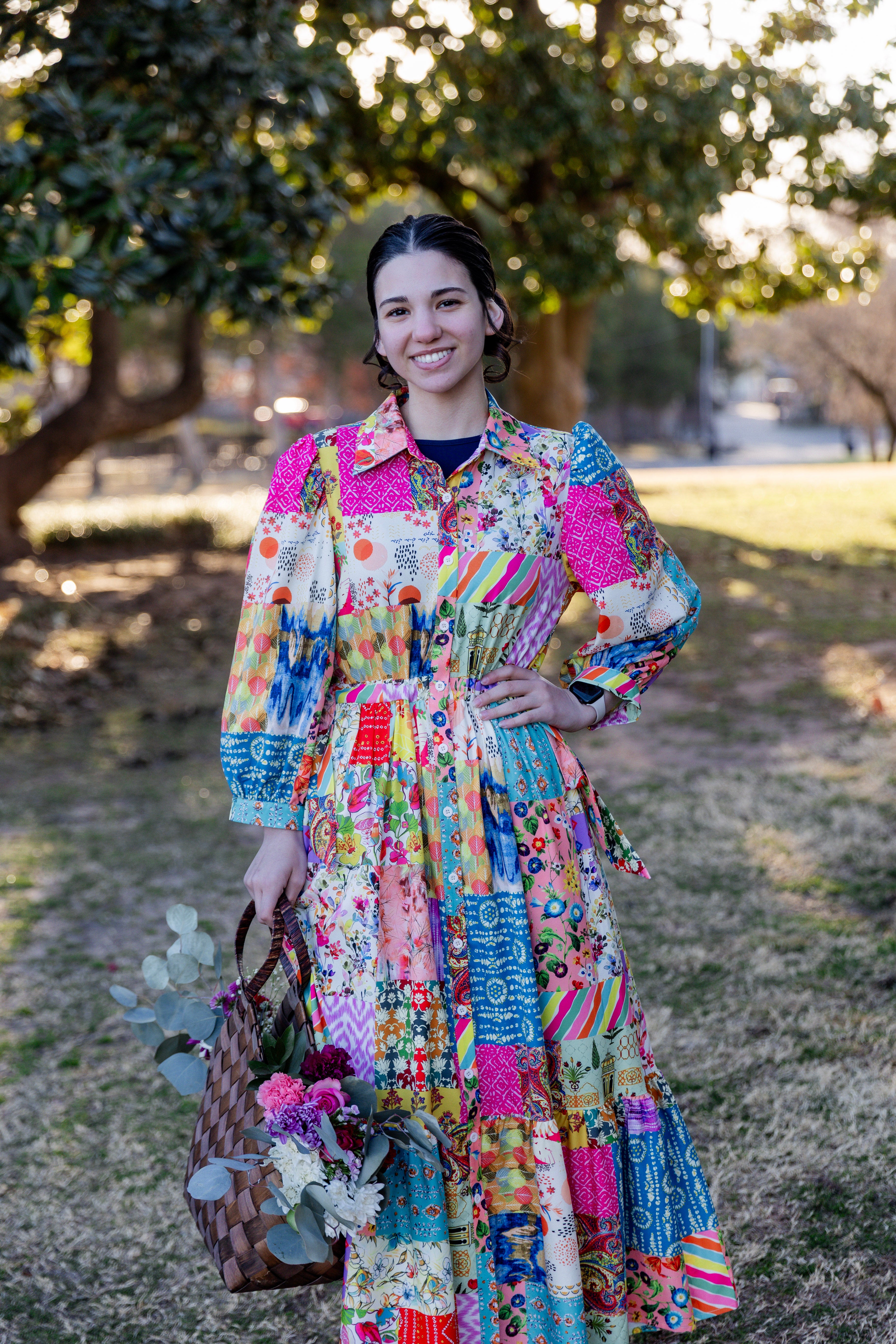 Model wearing the Nuggles® Leila Dress in Keepsake Quilt