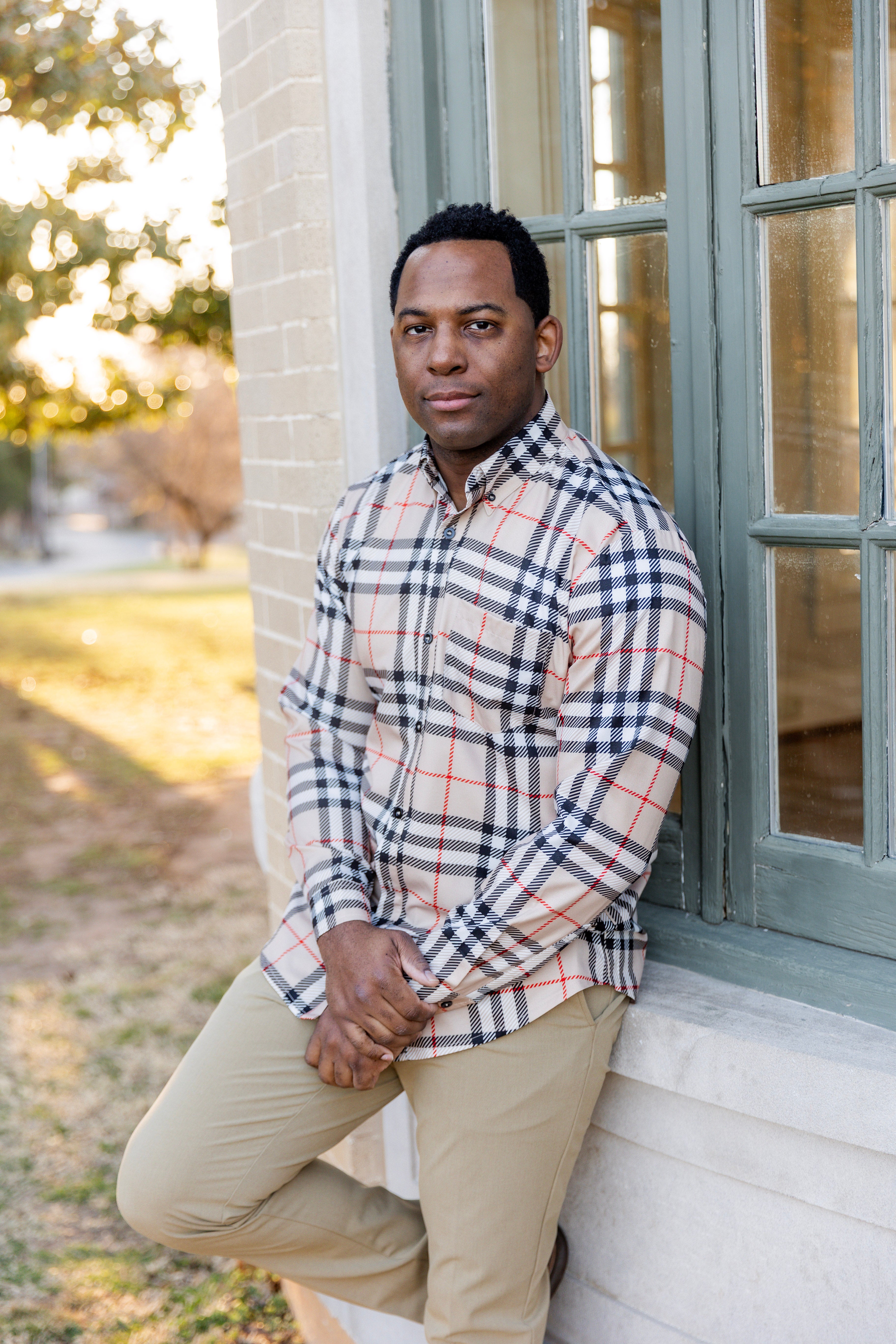 Model wearing Nuggles® Mens' Button Down Shirt Sand Plaid