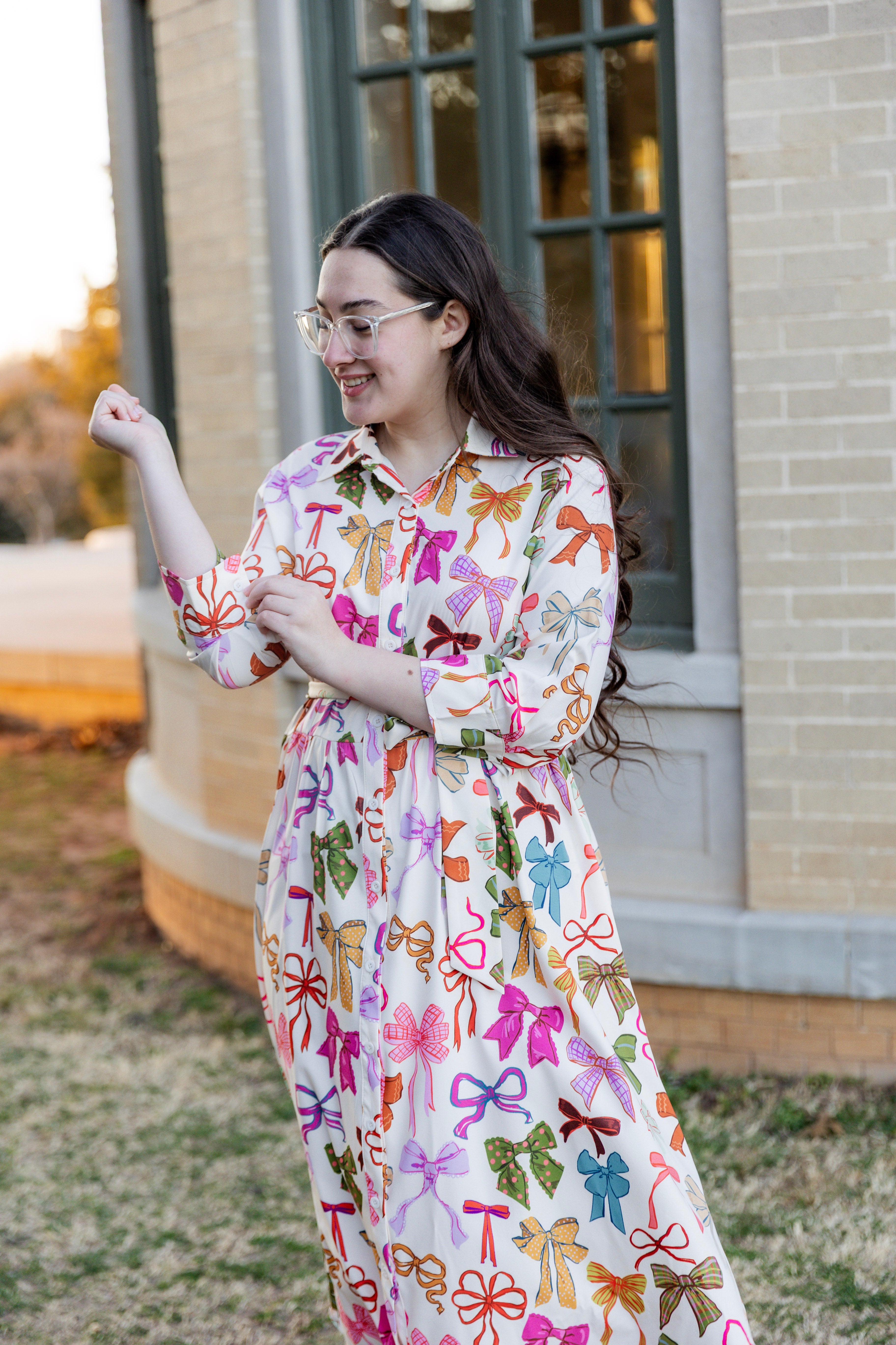 Model wearing the Nuggles® Rachel Dress in Bow Garden