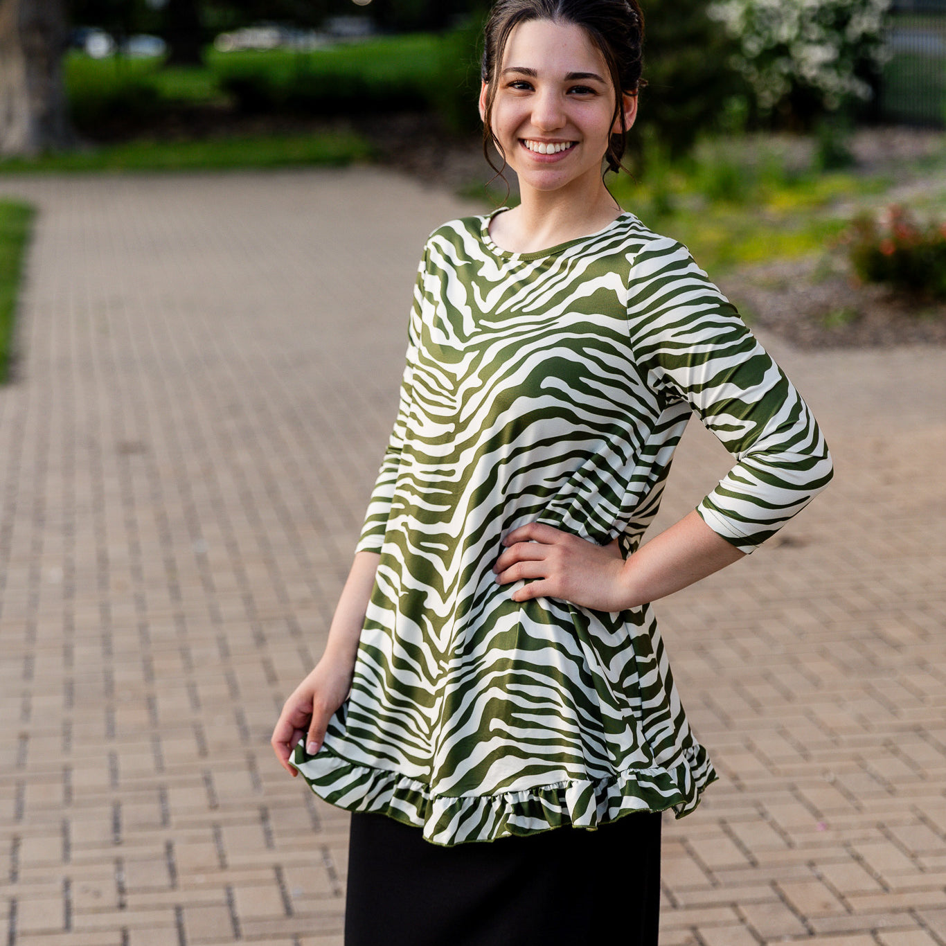 Model wearing the Avery Top, featuring modest 3/4 sleeves and a flowy, flattering fit.
