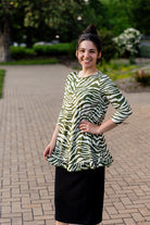 Model wearing the Avery Top, featuring modest 3/4 sleeves and a flowy, flattering fit.