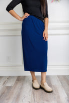 Model wearing a 31-inch classic lightweight midi skirt with an elastic waistband, styled modestly for everyday or church wear.