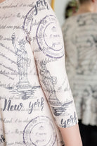 Modest print tunic for women – Nuggles® Rose Top with high-low ruffle hem and 3/4 sleeves.