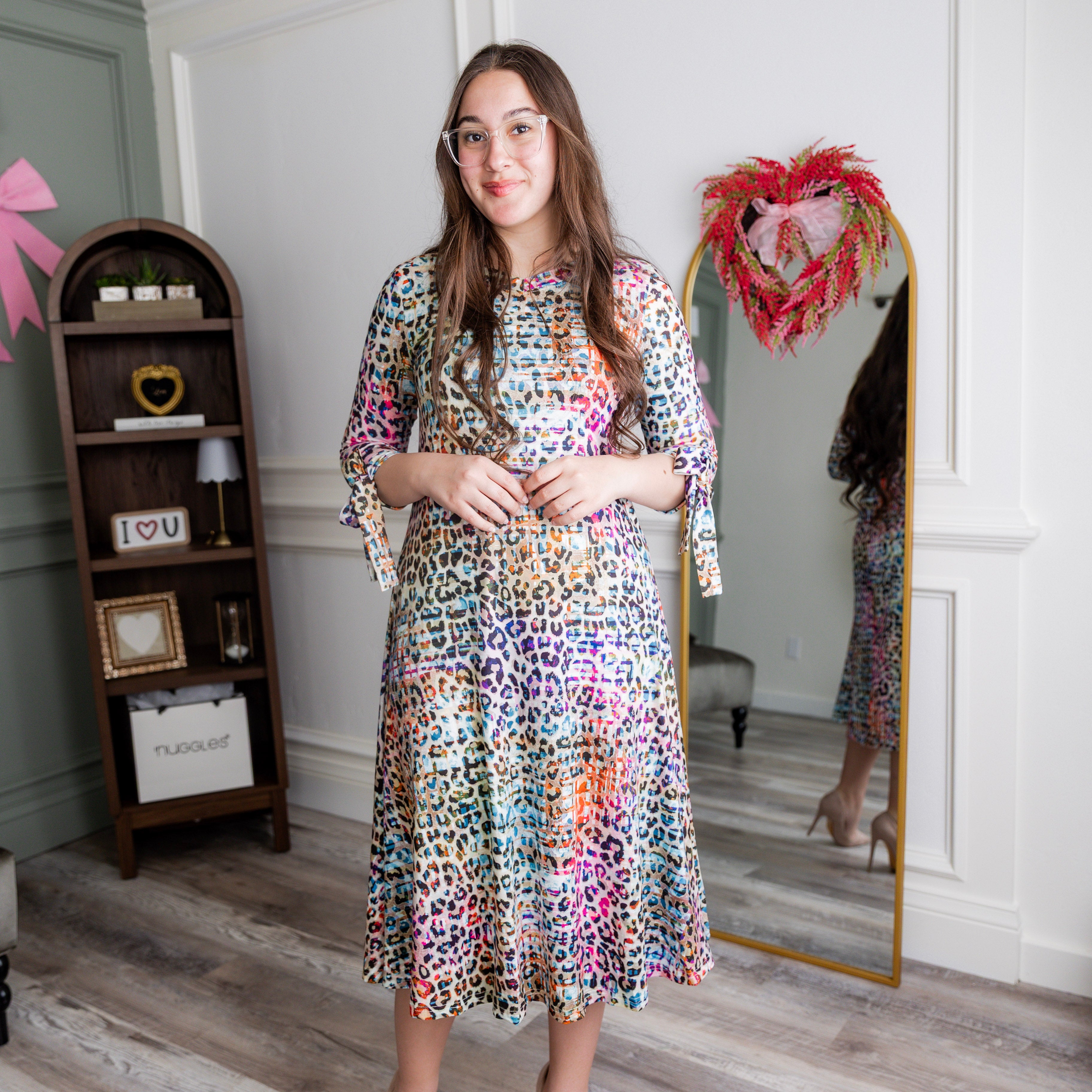 Model wearing Nuggles® Hazel Dress in Cotton Candy Cheetah print modest boutique style.