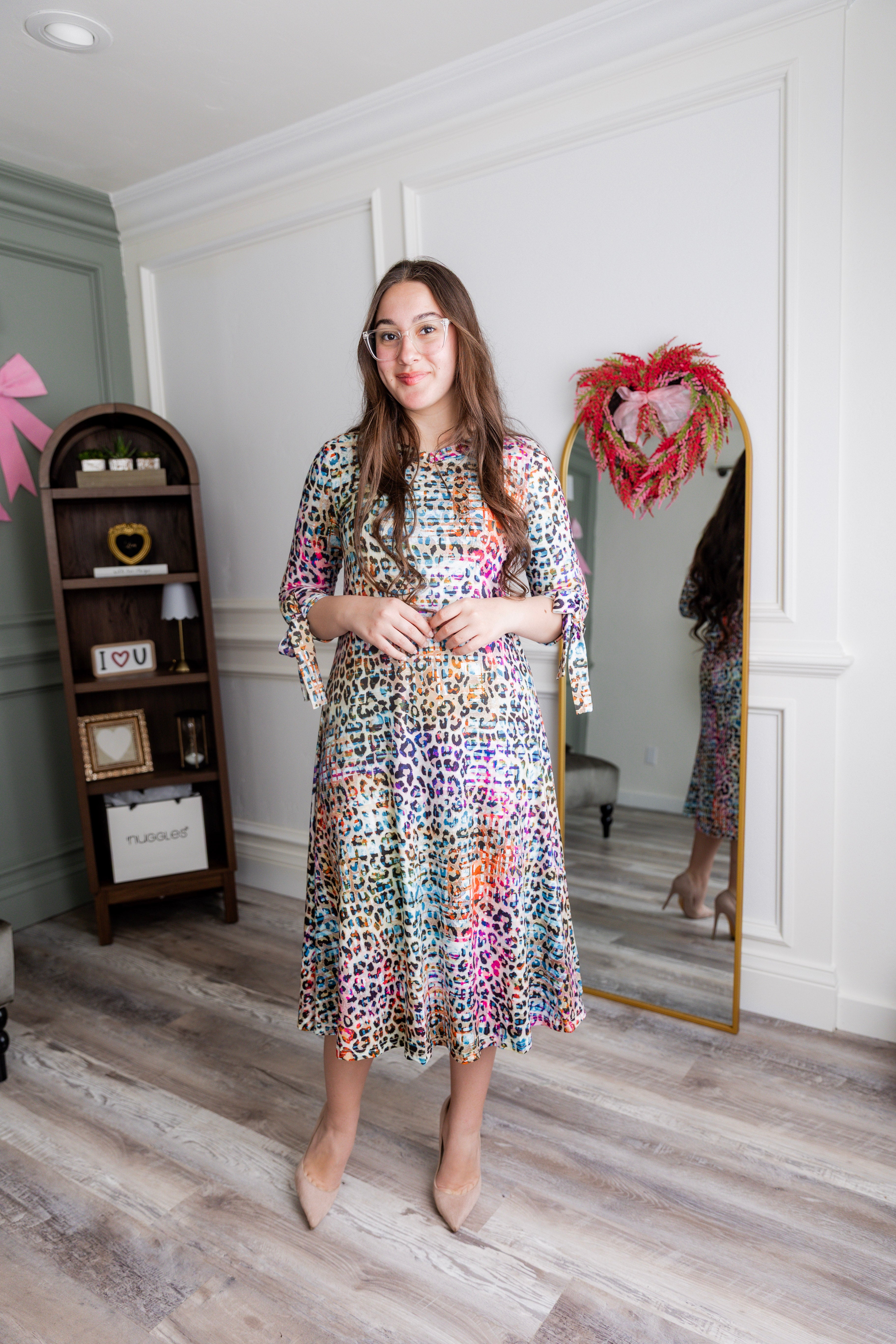 Model wearing Nuggles® Hazel Dress in Cotton Candy Cheetah print modest boutique style.