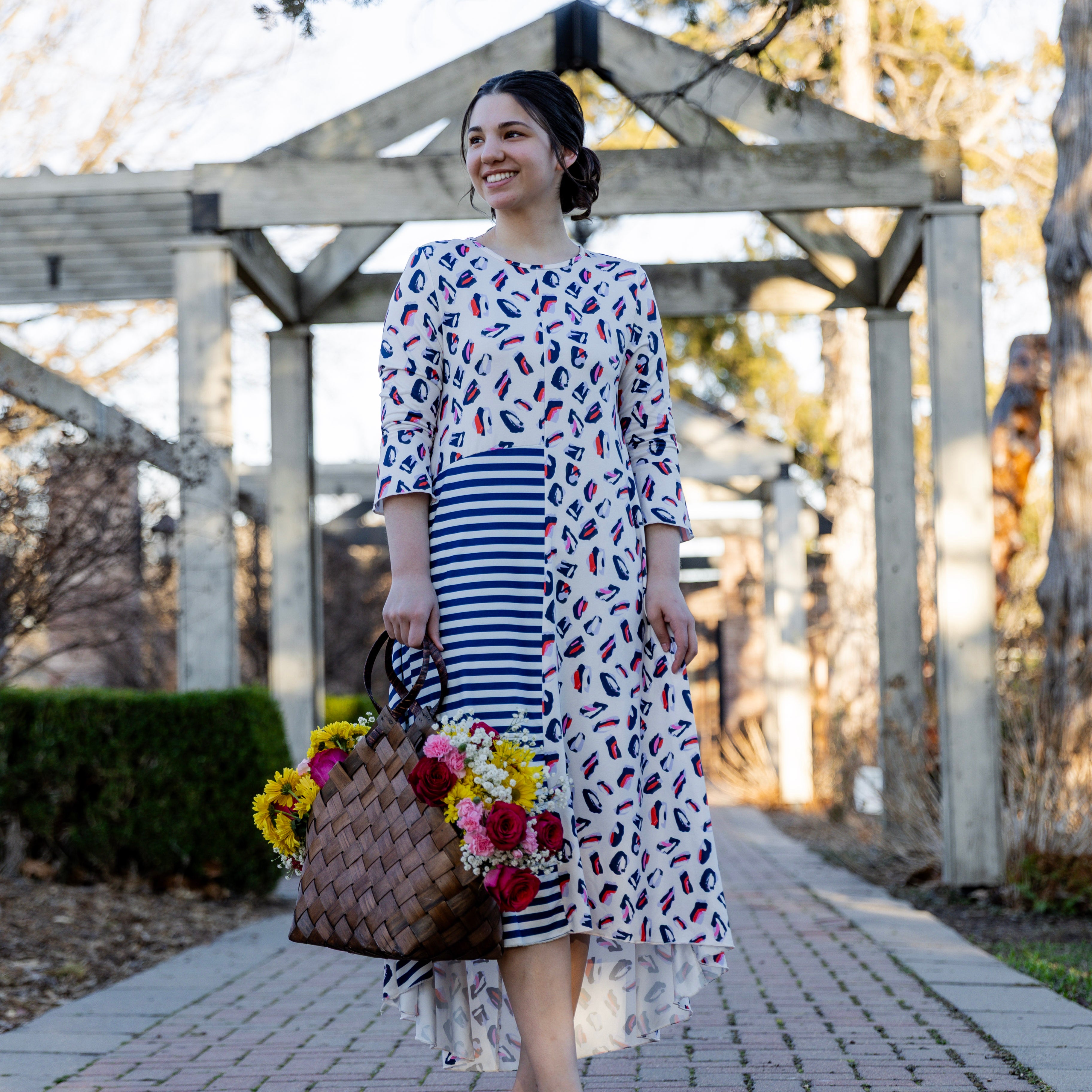 Modest high low knit dress with asymmetrical hem, ruffle sleeves, and mixed front prints – Kristine Dress by Nuggles®