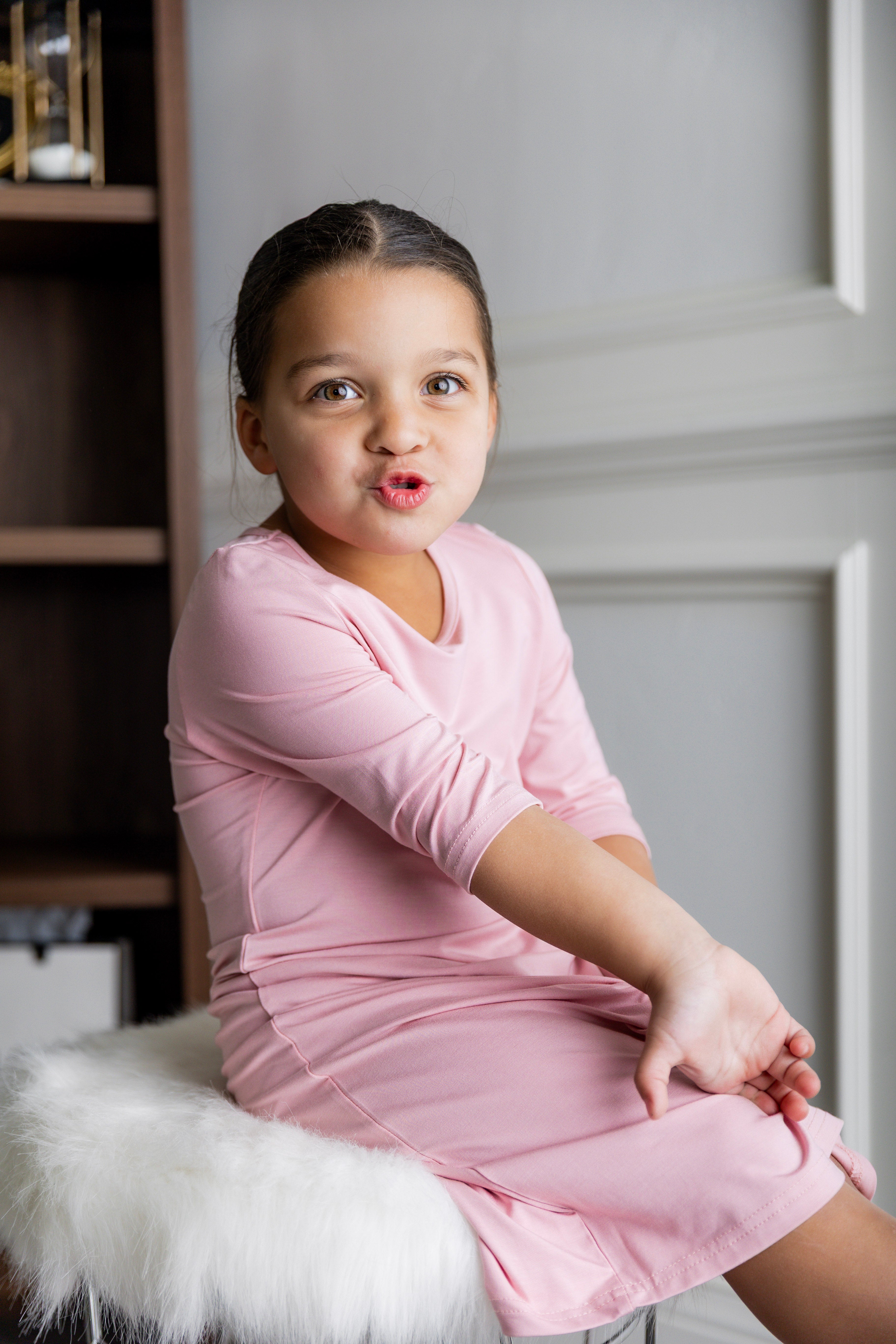 Model wearing our Nuggles® girls midi layering dress