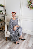 Model wearing the Nuggles® Liana Dress – modest midi dress with ¾ sleeves