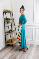 Model modeling Nuggles® Charay Dress with ¾ sleeves and high-low hem. Modest and stylish A-line dress with flattering fit.