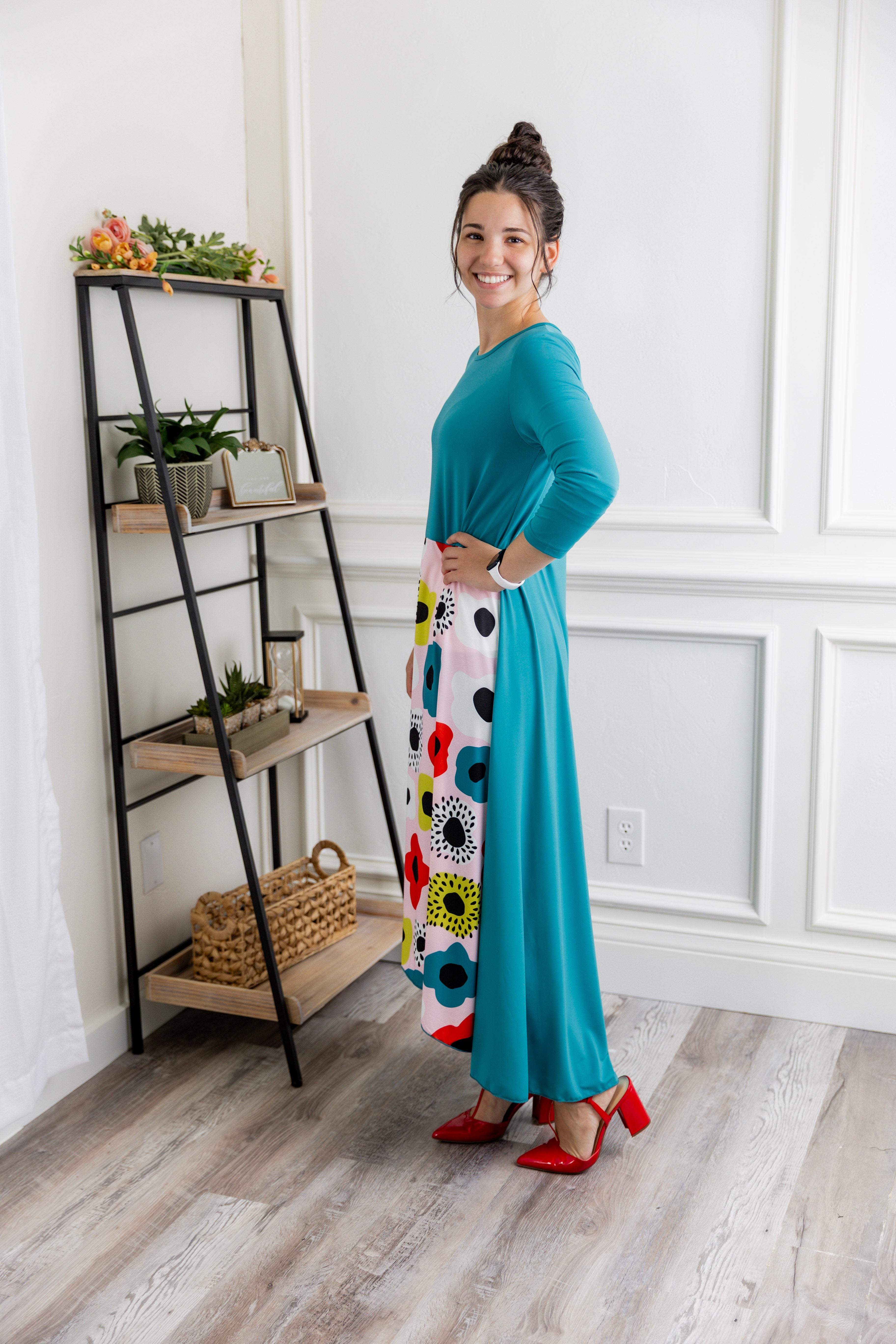 Model modeling Nuggles® Charay Dress with ¾ sleeves and high-low hem. Modest and stylish A-line dress with flattering fit.