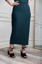 Textured midi-length skirt with elastic waistband and modest fit.
