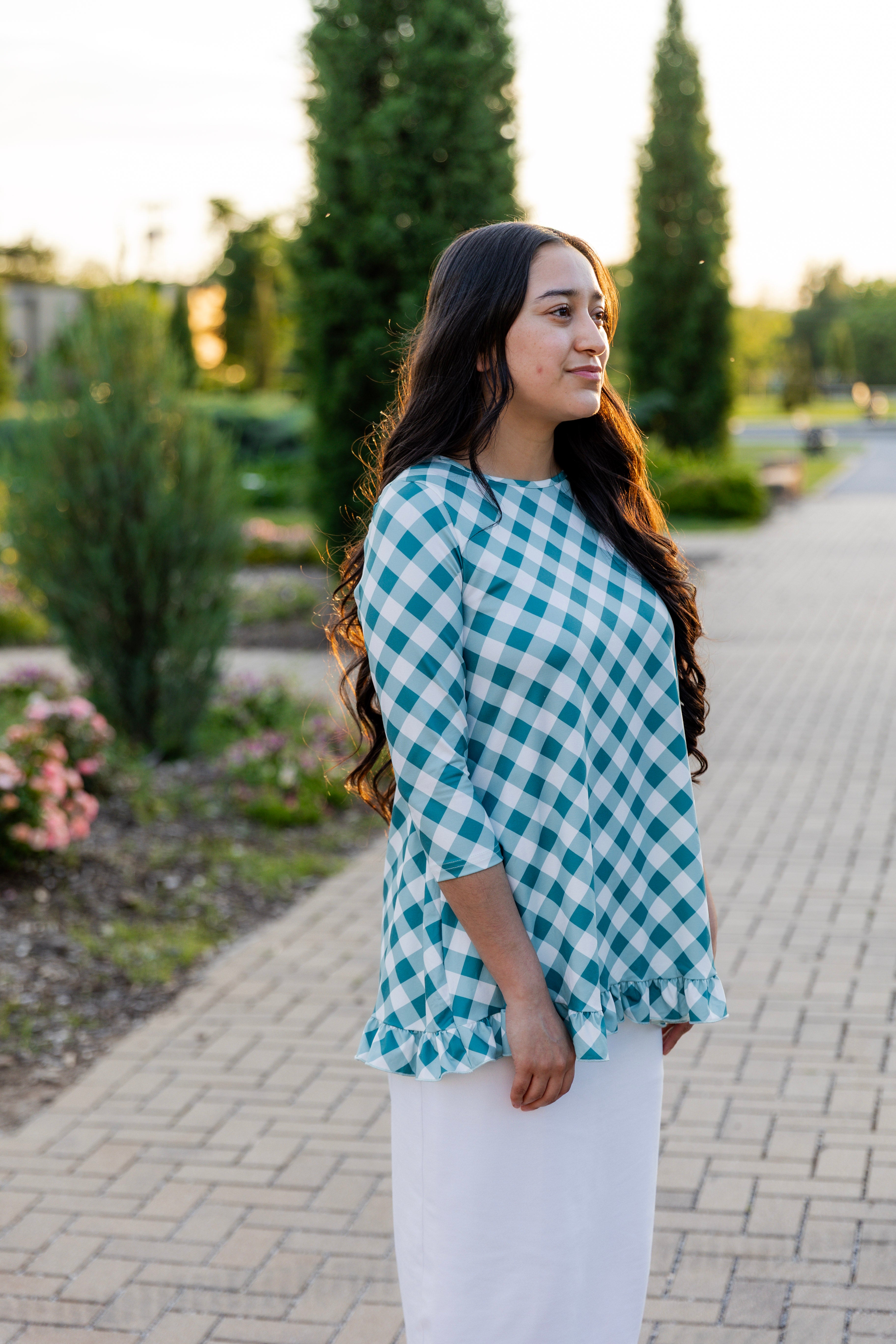 Model wearing the Avery Top, featuring modest 3/4 sleeves and a flowy, flattering fit.