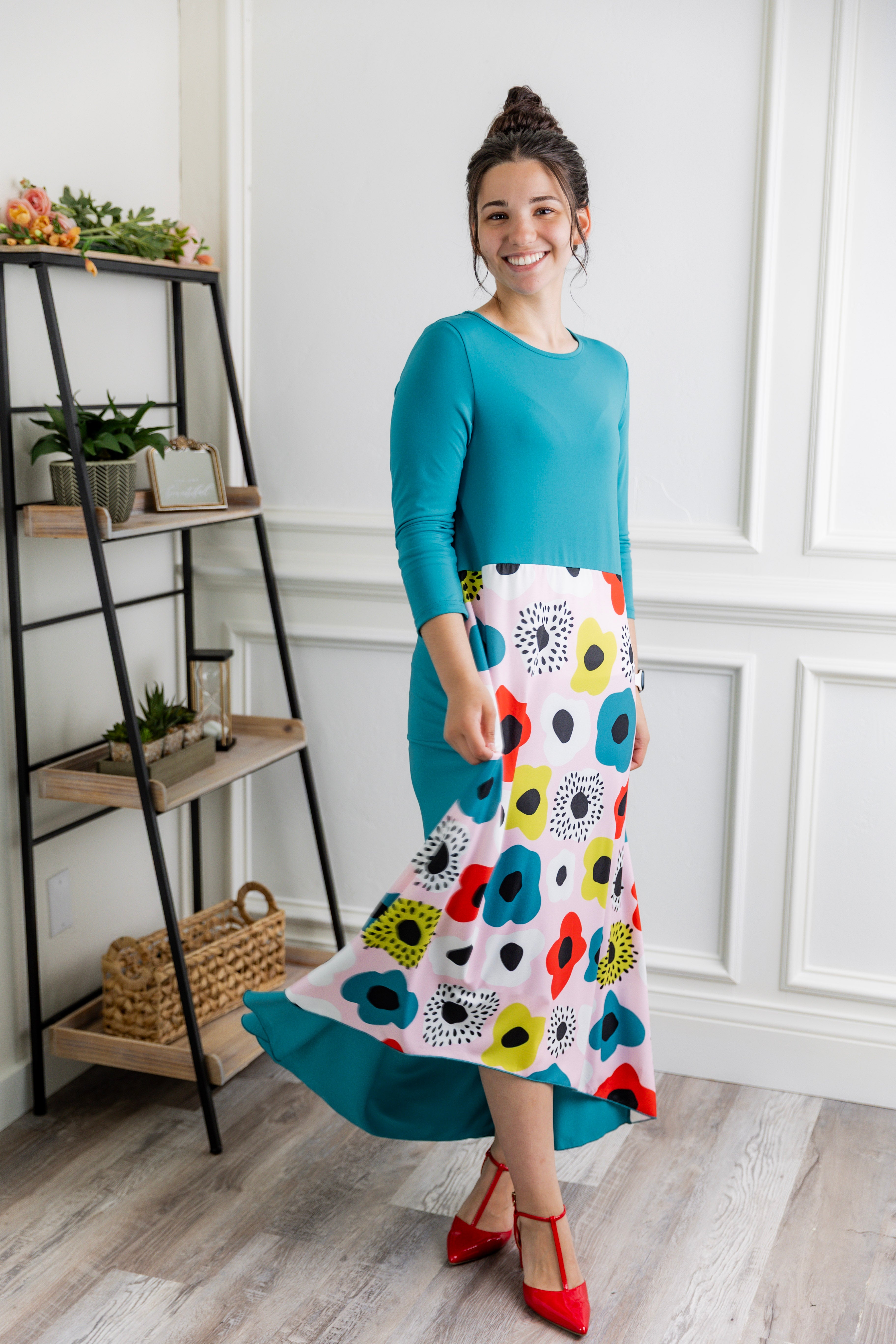 Model modeling Nuggles® Charay Dress with ¾ sleeves and high-low hem. Modest and stylish A-line dress with flattering fit.