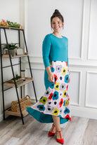 Model modeling Nuggles® Charay Dress with ¾ sleeves and high-low hem. Modest and stylish A-line dress with flattering fit.