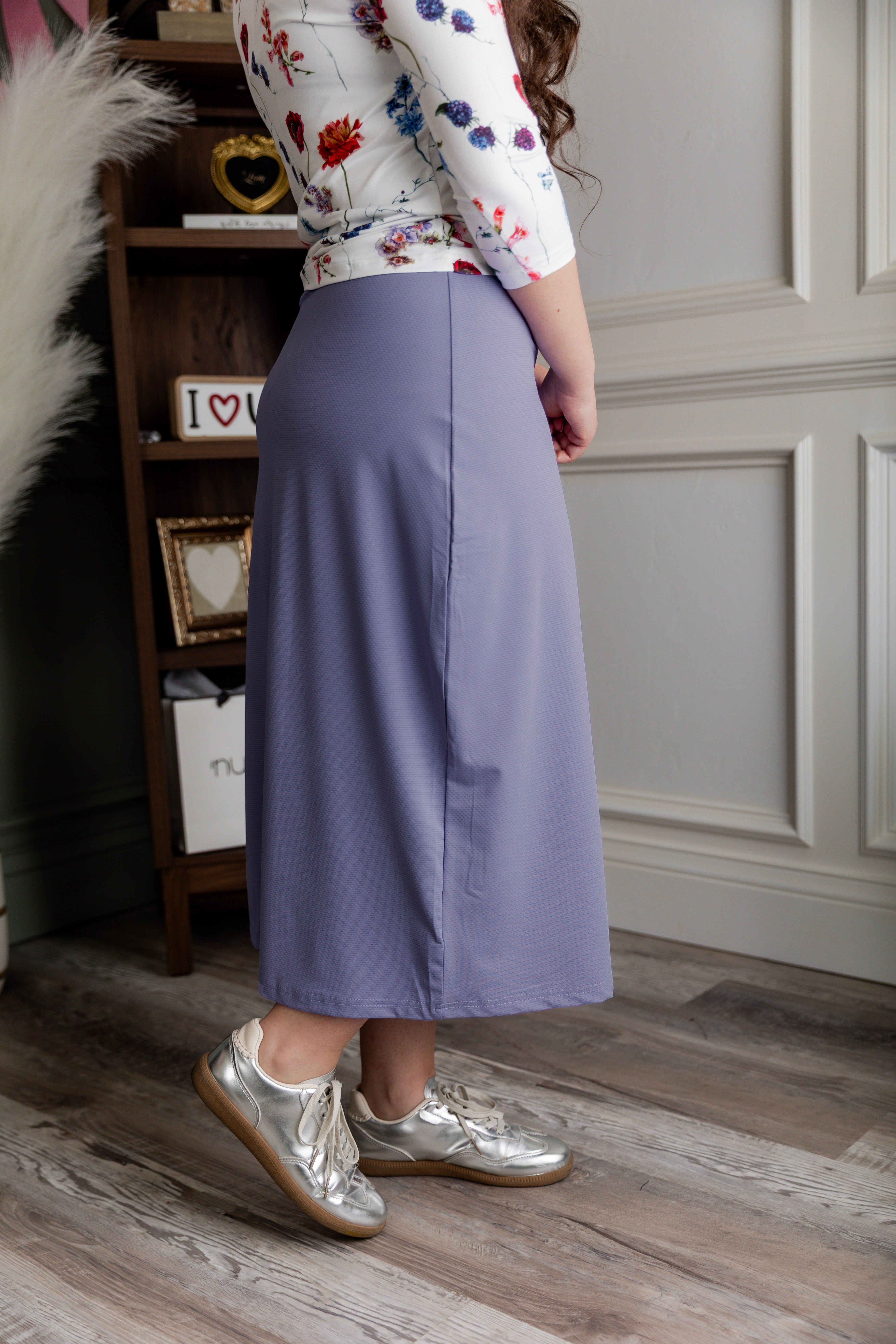 Model wearing Nuggles® 31" All-Sport Skirt in Pastel Purple