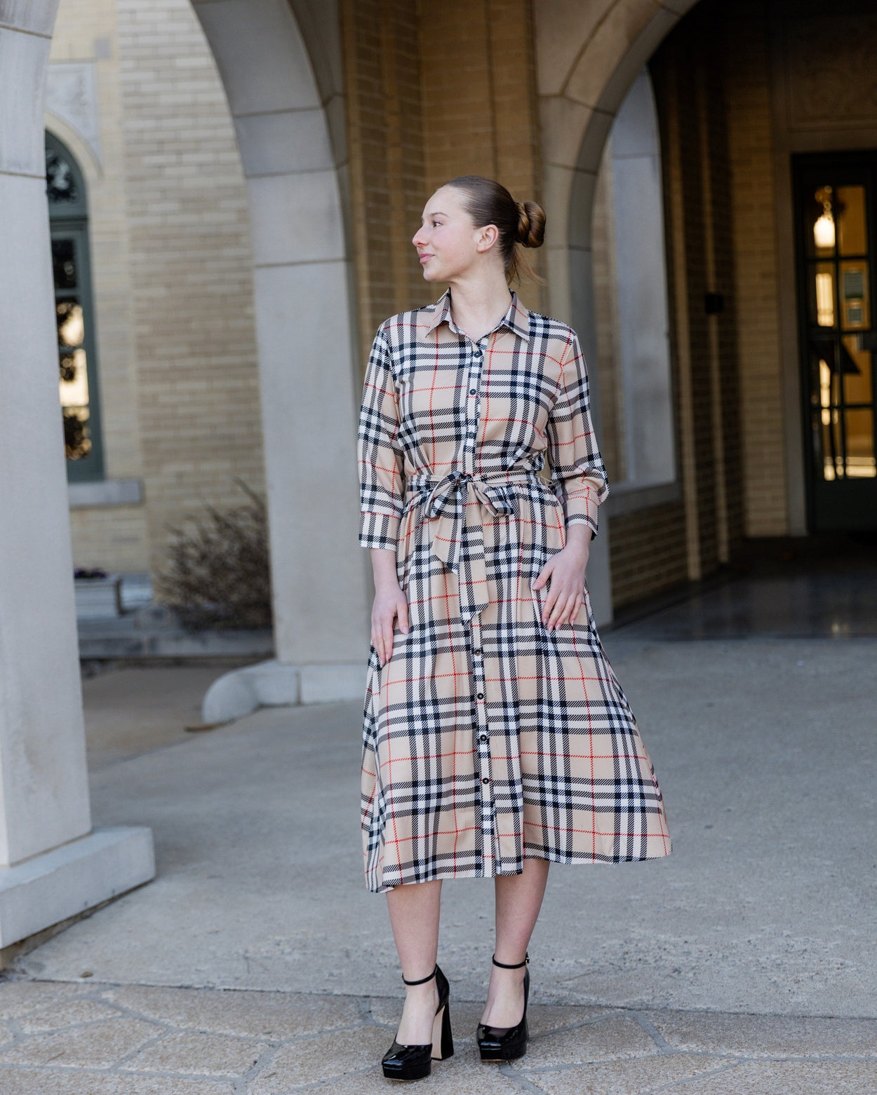 Model wearing the Nuggles® Rachel Dress in Sand Plaid