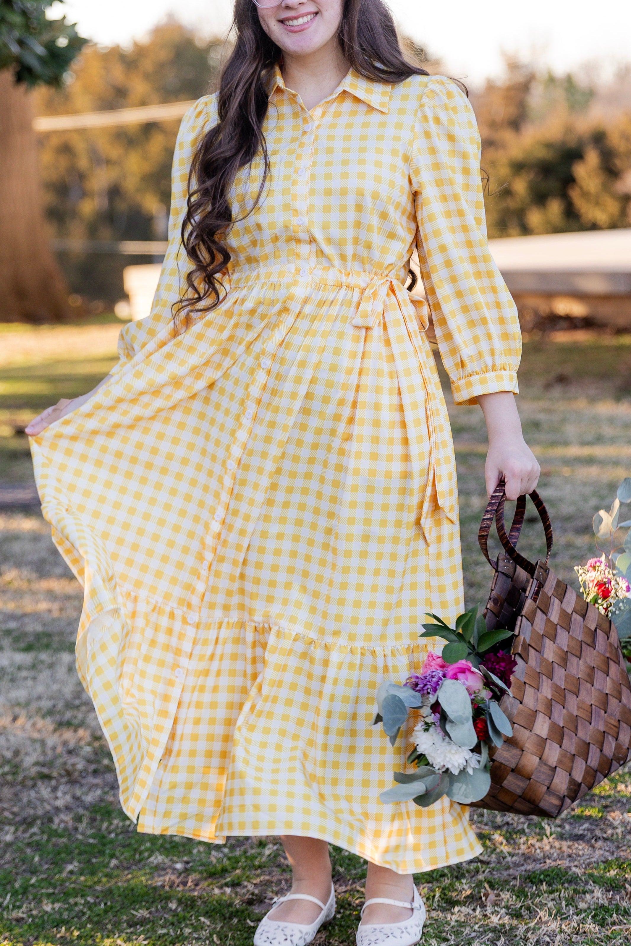 Model wearing the Nuggles® Leila Dress in Sunshine Check