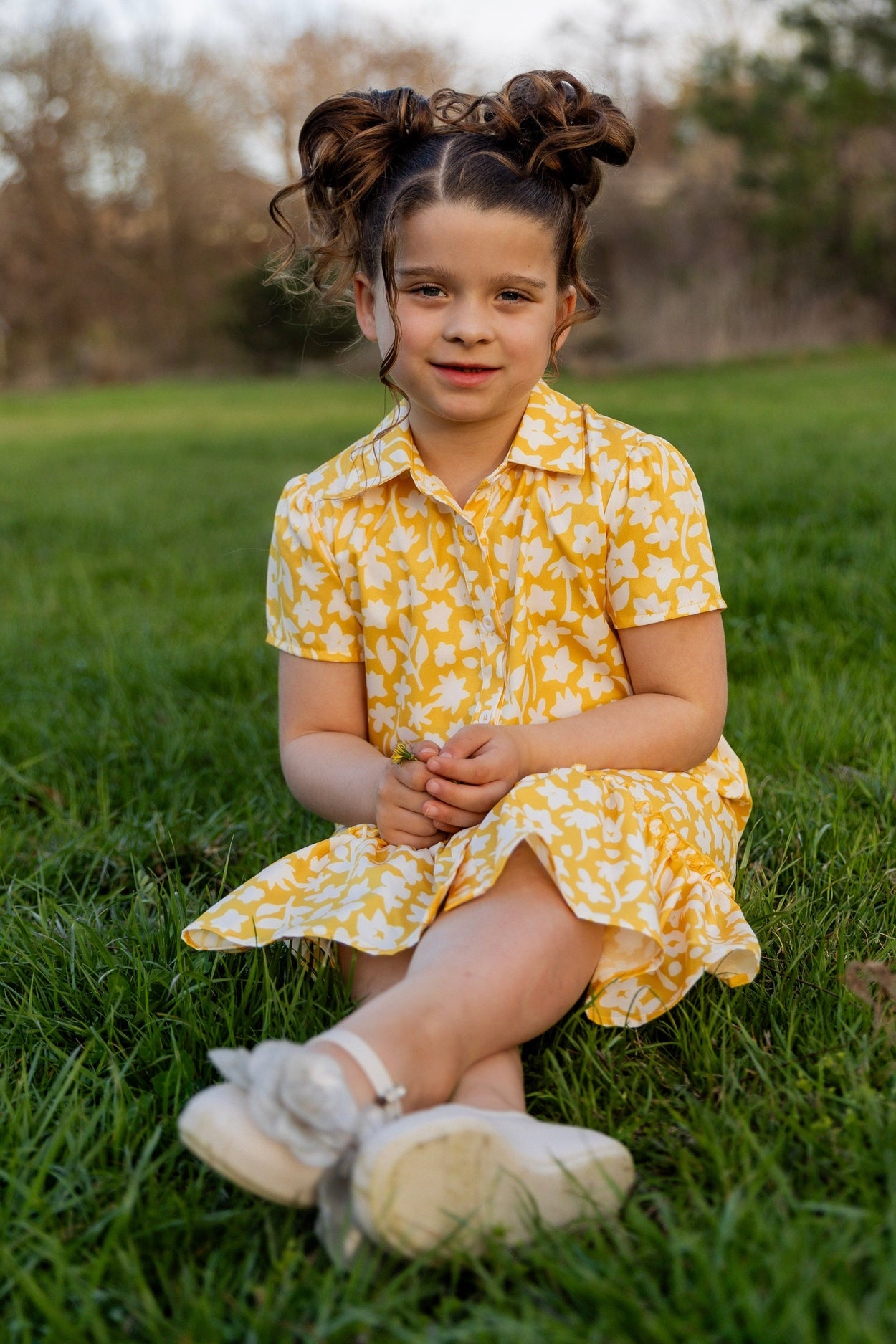 Model wearing Nuggles® Girls' Ellie Dress Dress in Sunshine Sprigs