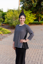 Model wearing the Adrielle Top with 3/4 sleeves and a classic skirt – modest women's top from Nuggles®