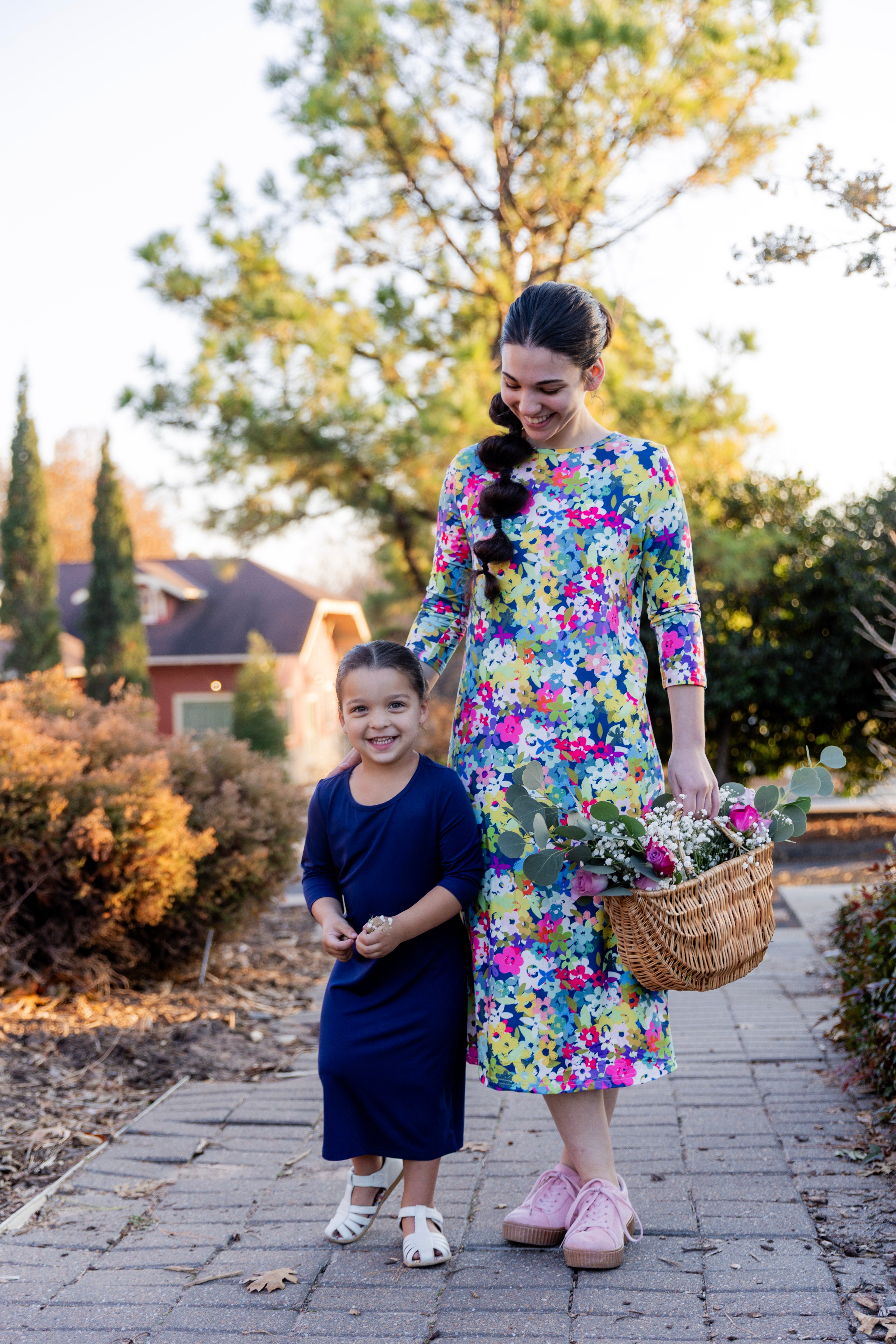 Model wearing the Nuggles® Original Midi Layering Dress in Wildflower Haze