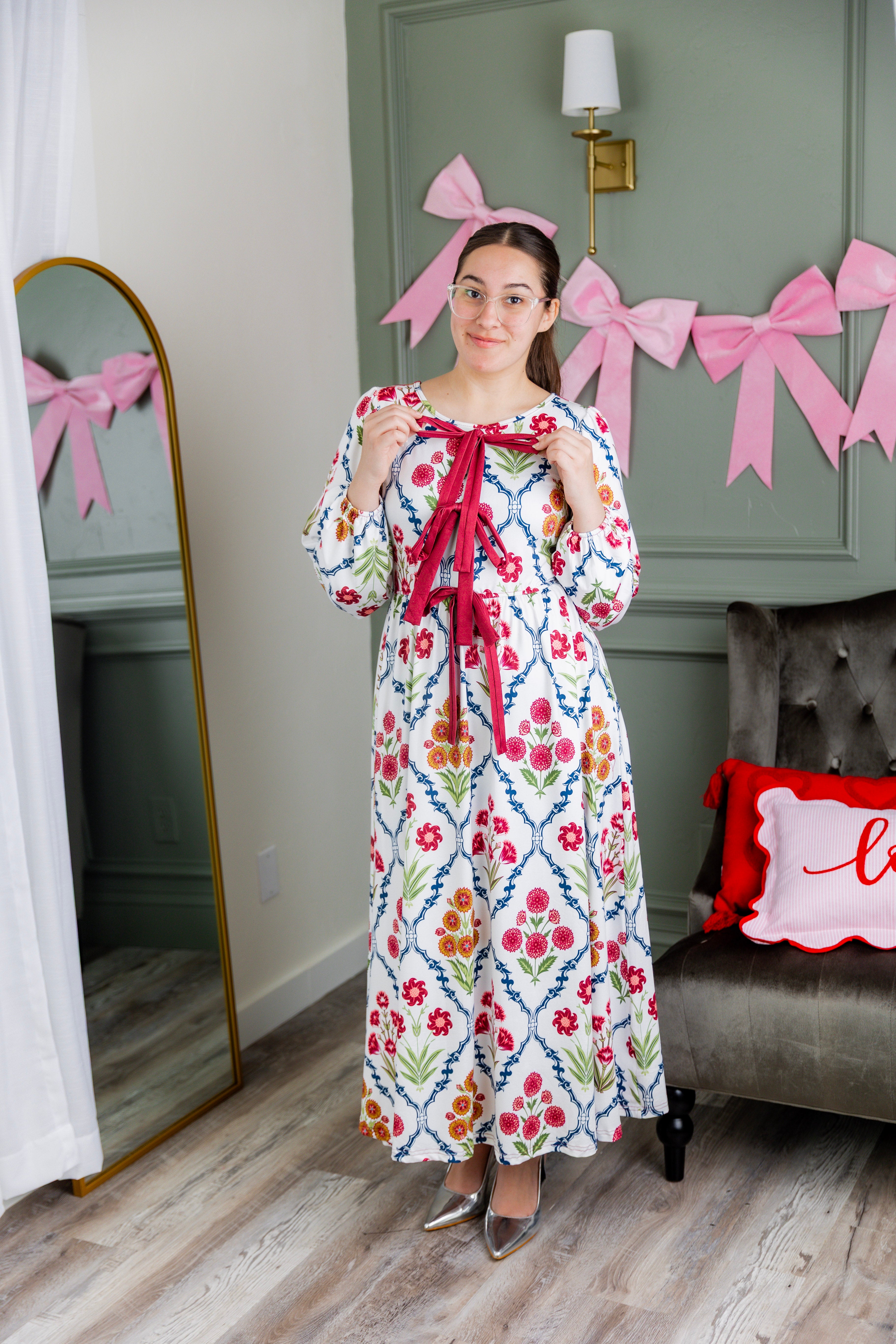 Model wearing the Nuggles® Addison Dress in Wildflower Trellis