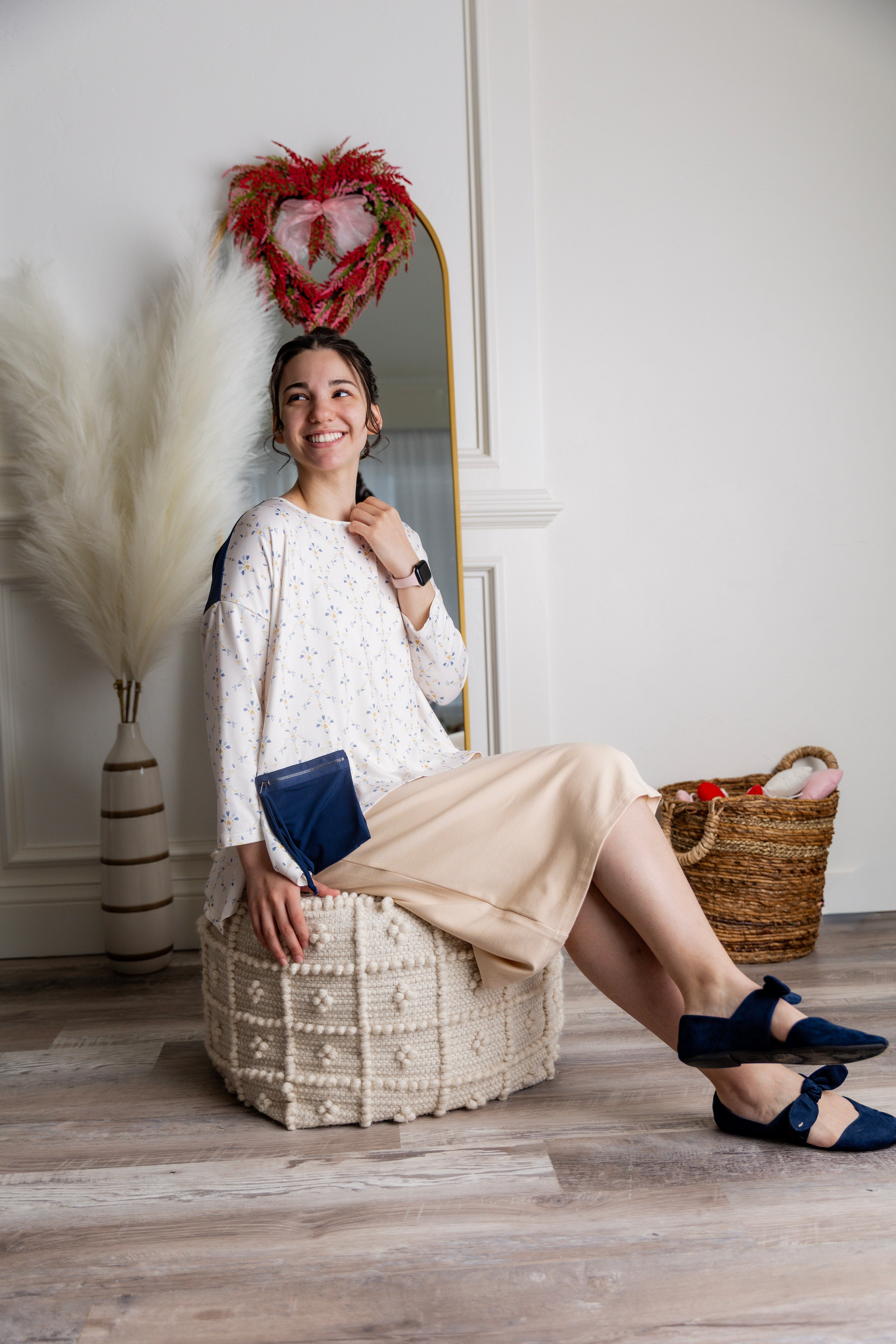 Model wearing the Nuggles® Keegan Top in Dewdrop Ivory floral print modest boutique top