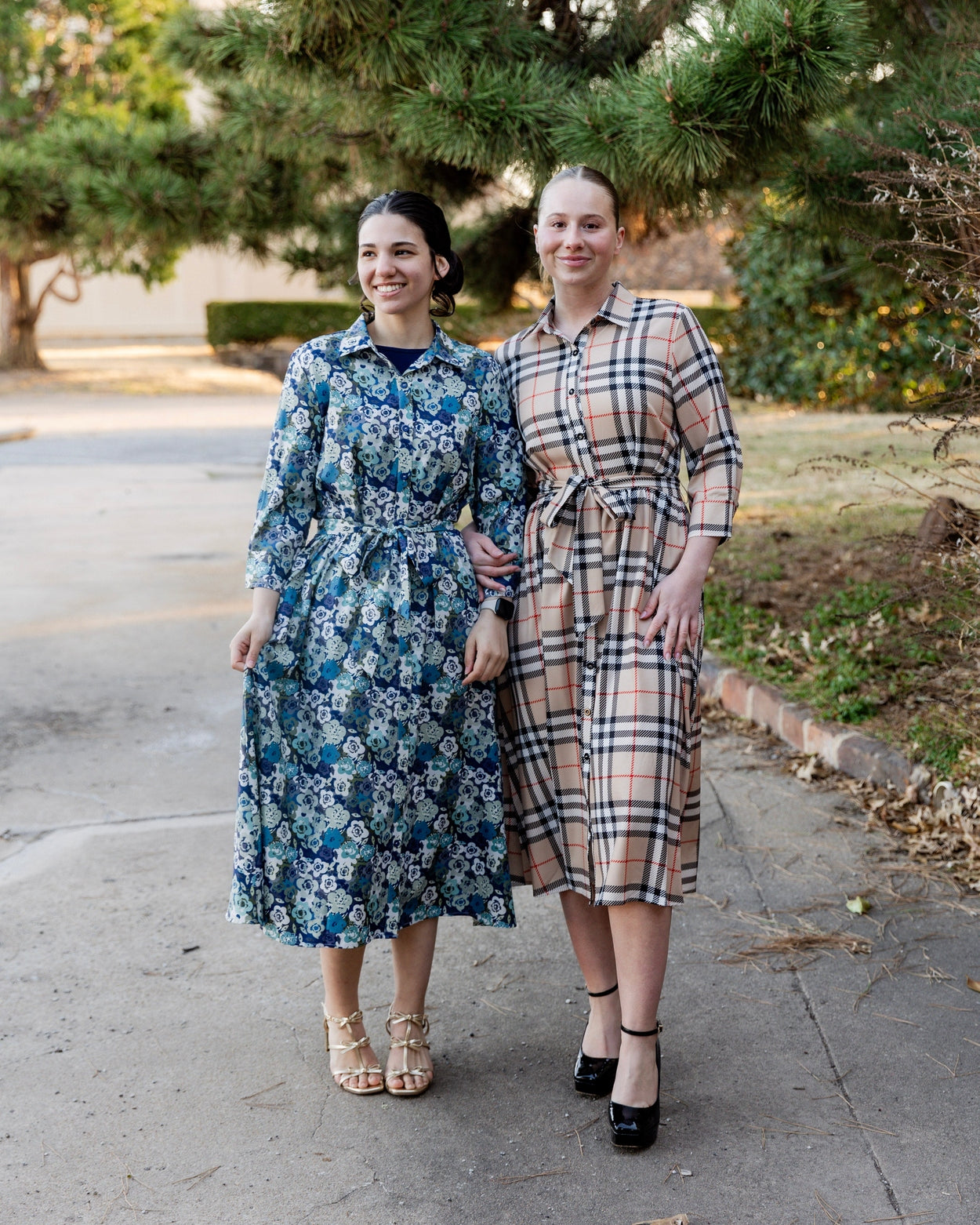 Model wearing the Nuggles® Rachel Dress in Sand Plaid