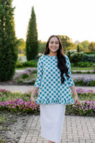 Model wearing the Avery Top, featuring modest 3/4 sleeves and a flowy, flattering fit.