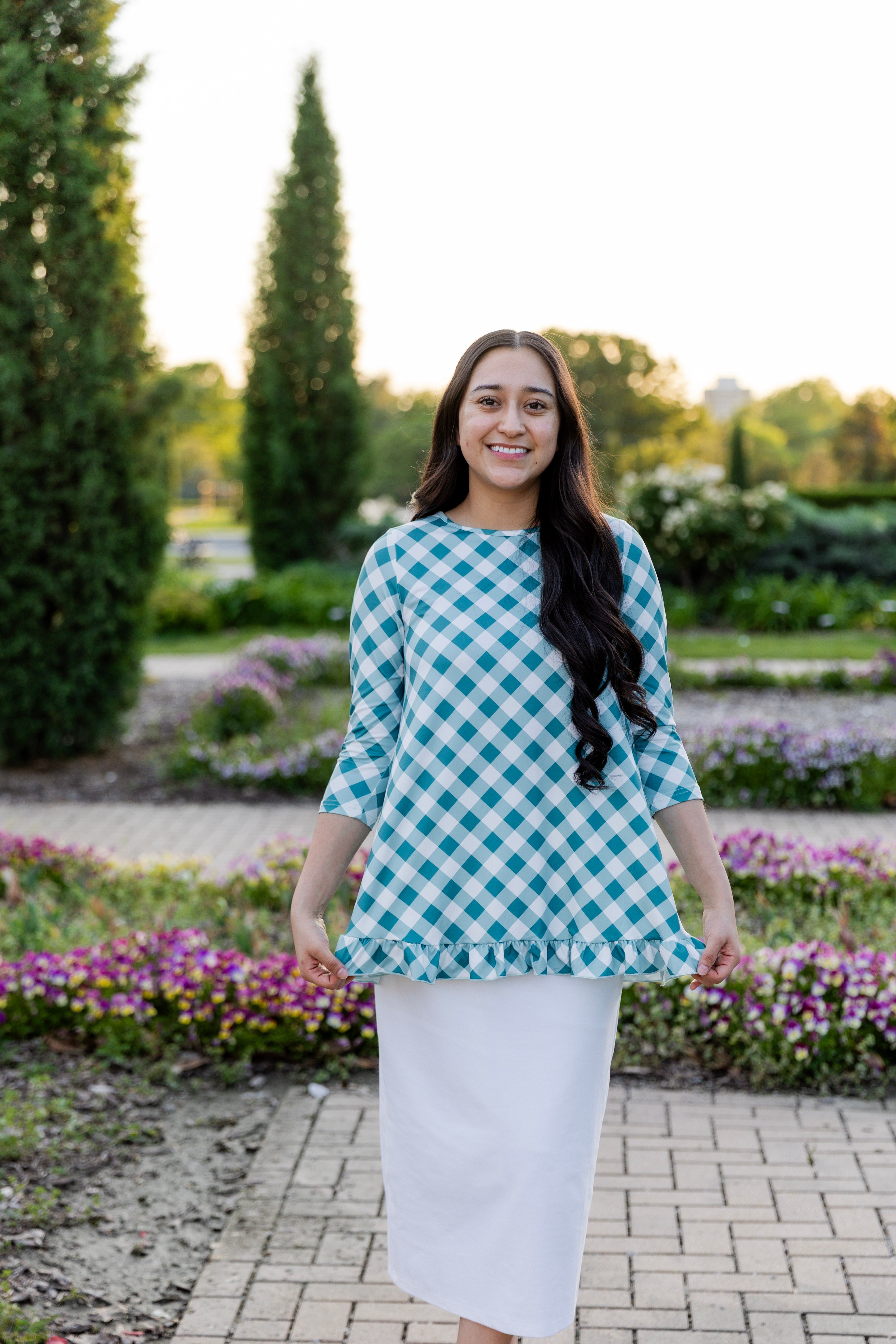 Model wearing the Avery Top, featuring modest 3/4 sleeves and a flowy, flattering fit.