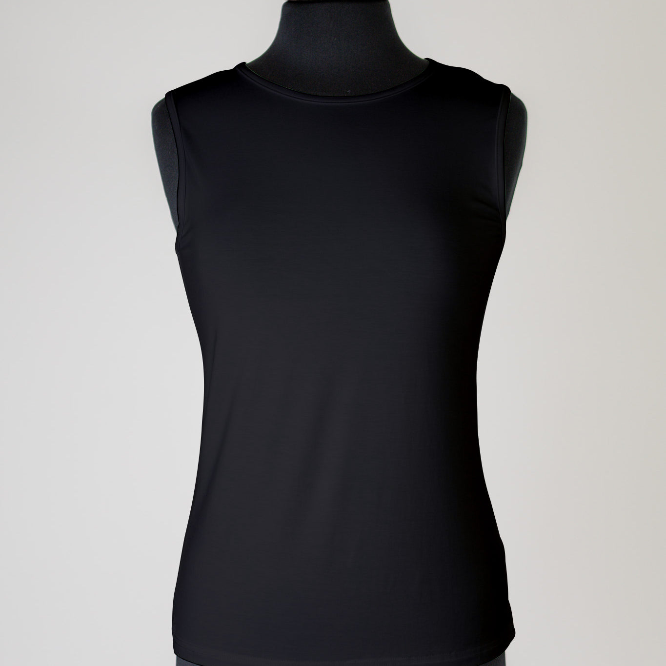 The Nuggles® Essential Tank – a modest, fitted layering tank top with wide straps and a high neckline, perfect for everyday wear.