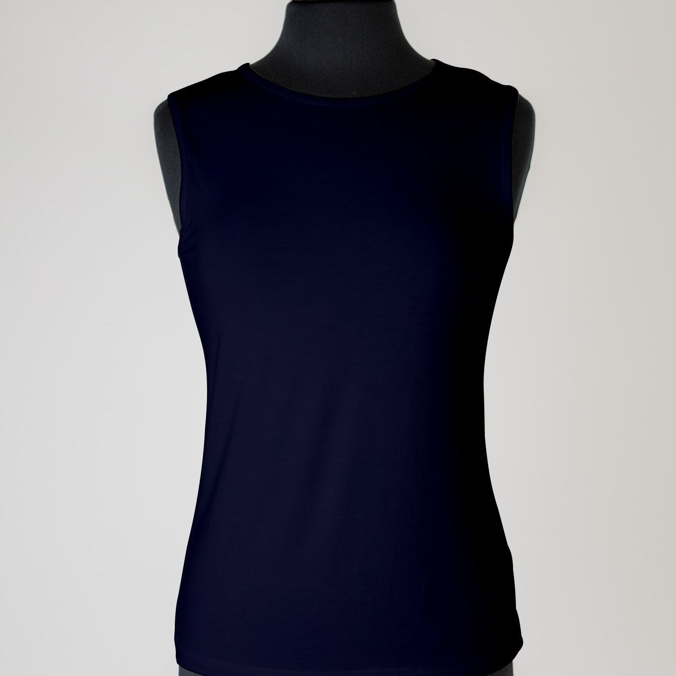 The Nuggles® Essential Tank – a modest, fitted layering tank top with wide straps and a high neckline, perfect for everyday wear.