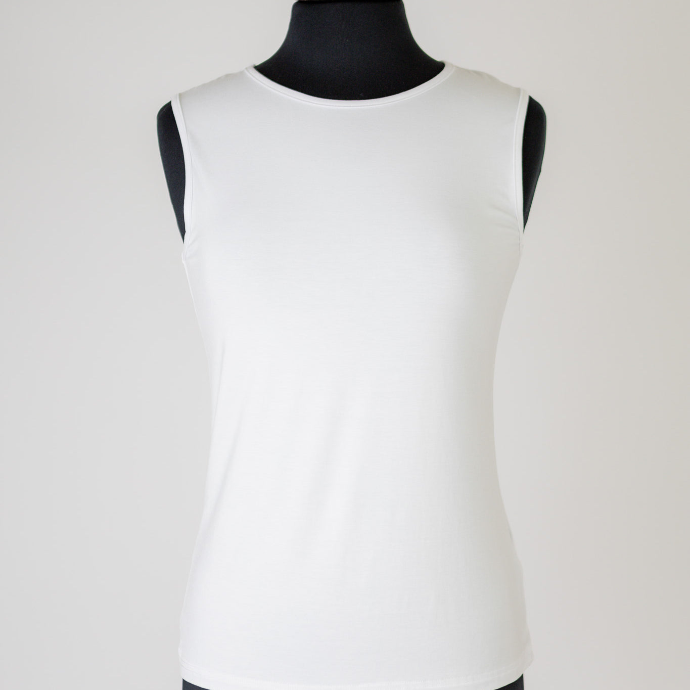The Nuggles® Essential Tank – a modest, fitted layering tank top with wide straps and a high neckline, perfect for everyday wear.