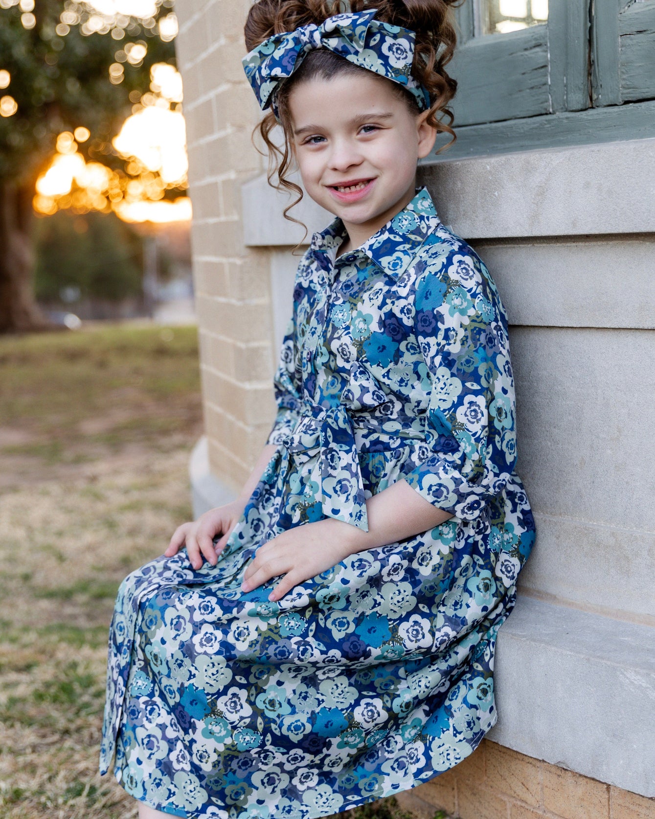 Model wearing the Nuggles® Girls' Rachel Dress in Storm Brush