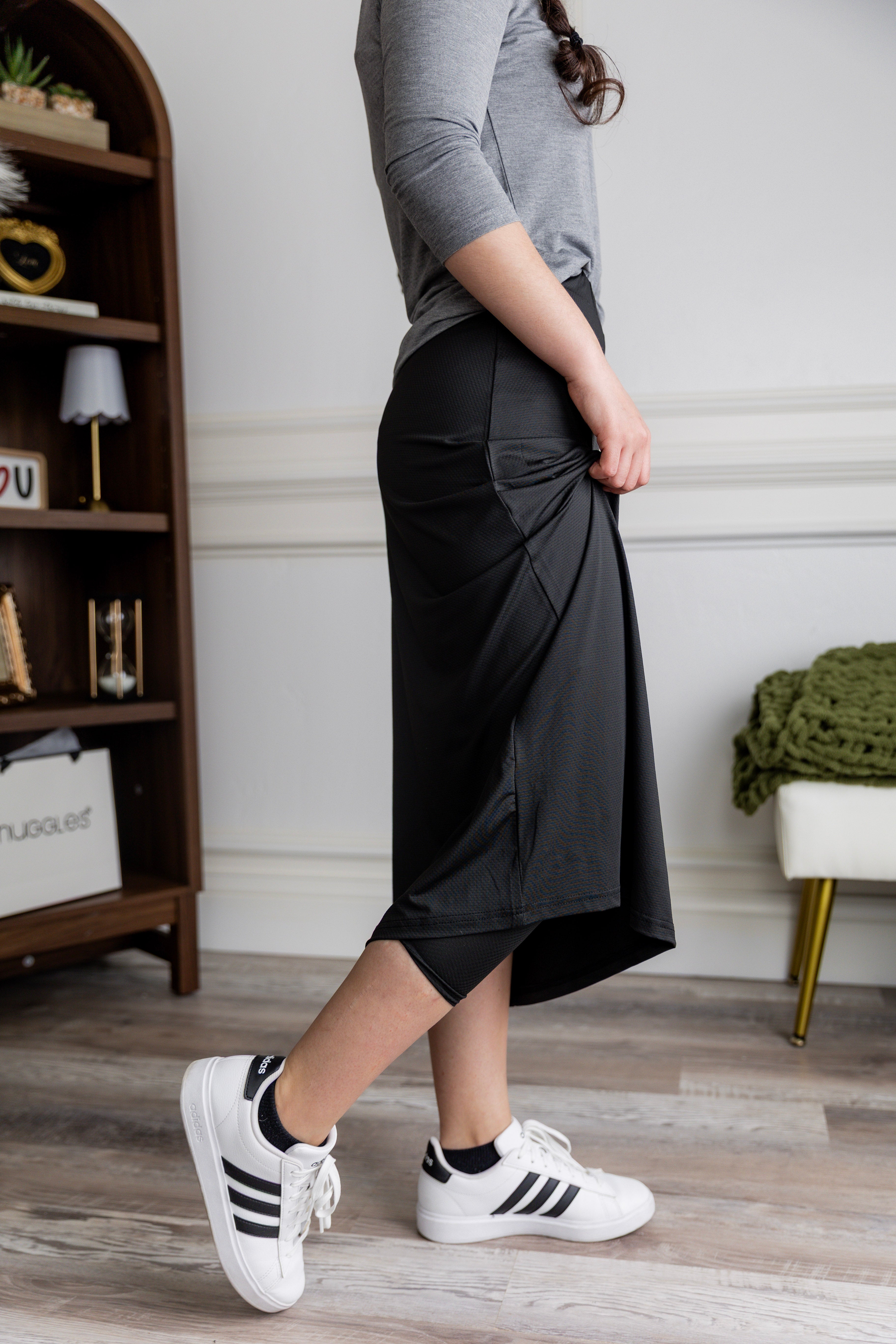 Model wearing Nuggles® 31" All-Sport Skirt in Black