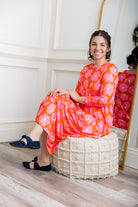 Model wearing Emma Bubble Dress in pretty prints, showcasing full bubble skirt and modest fit.