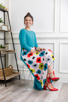 Model modeling Nuggles® Charay Dress with ¾ sleeves and high-low hem. Modest and stylish A-line dress with flattering fit.