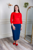Model showcasing  Nuggles® midi tee skirts in various solid colors, modest 27" and 31" lengths