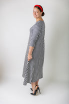 Model wearing the Nuggles® Liana Dress – modest midi dress with ¾ sleeves