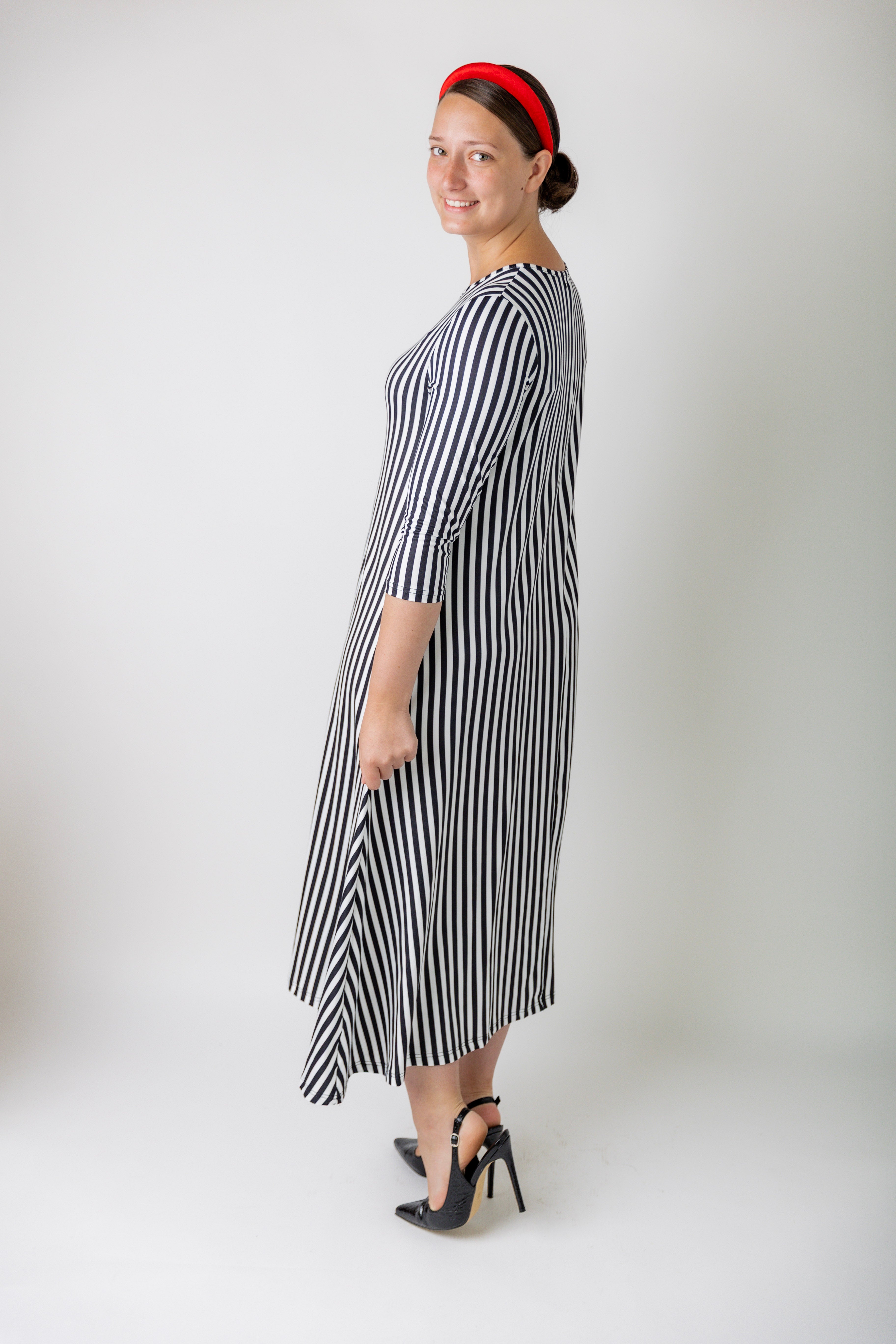 Model wearing the Nuggles® Liana Dress – modest midi dress with ¾ sleeves