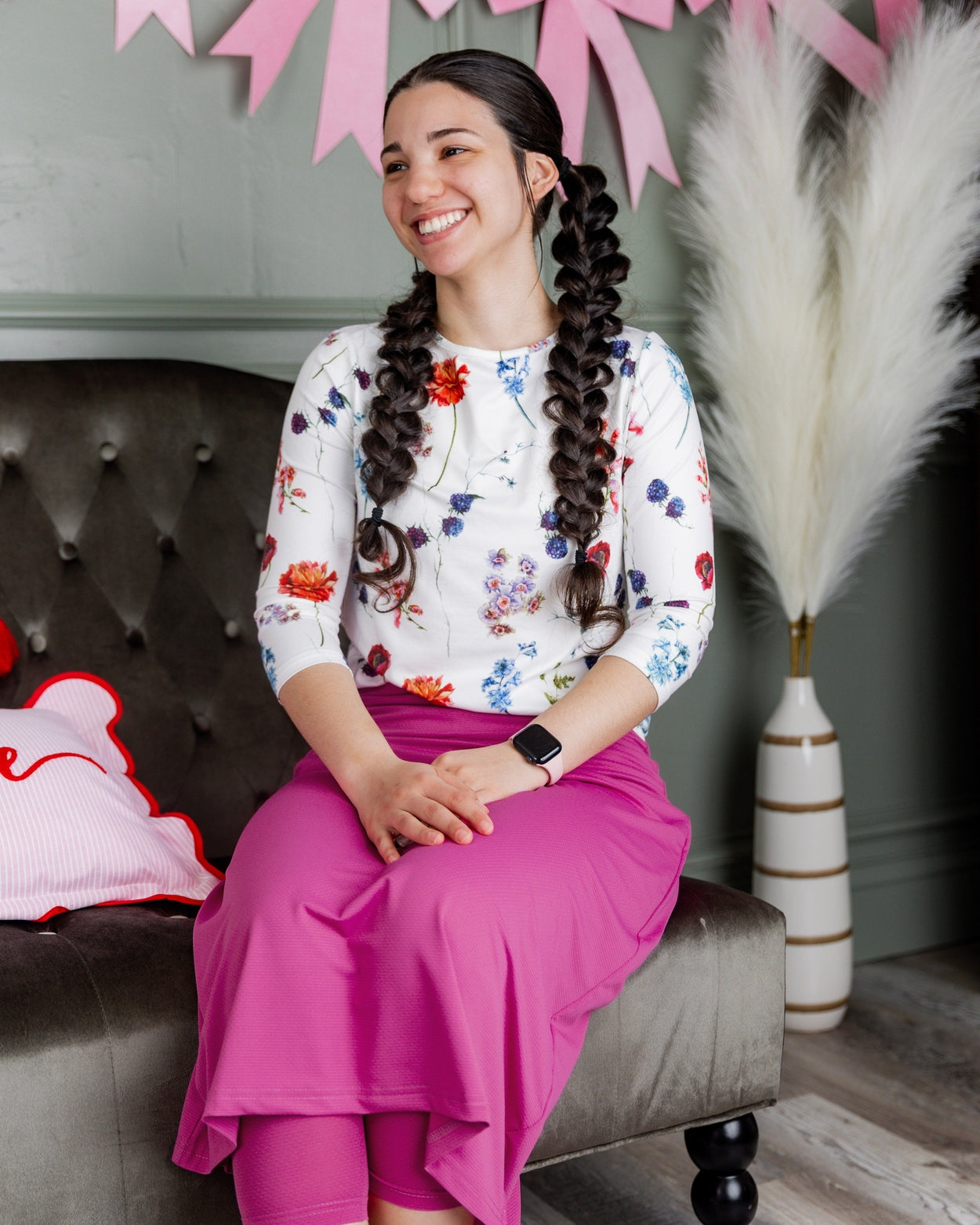 Model wearing Nuggles® 31" All-Sport Skirt in Hot Pink