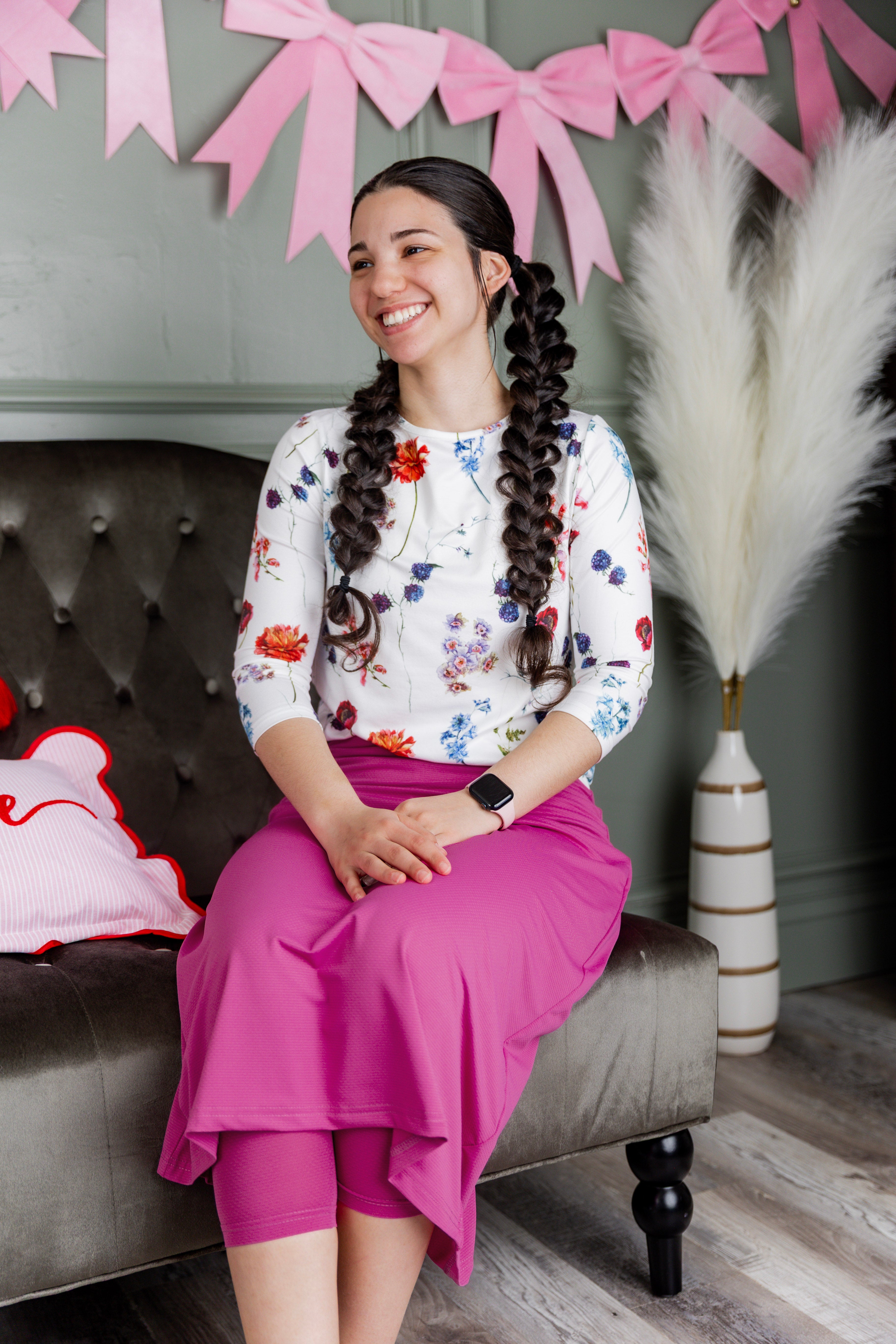 Model wearing Nuggles® 31" All-Sport Skirt in Hot Pink