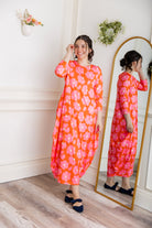 Model wearing Emma Bubble Dress in pretty prints, showcasing full bubble skirt and modest fit.