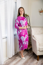 Modest dolman sleeve dress for women with relaxed fit and tapered hem, made from soft stretch knit fabric – perfect for everyday wear.