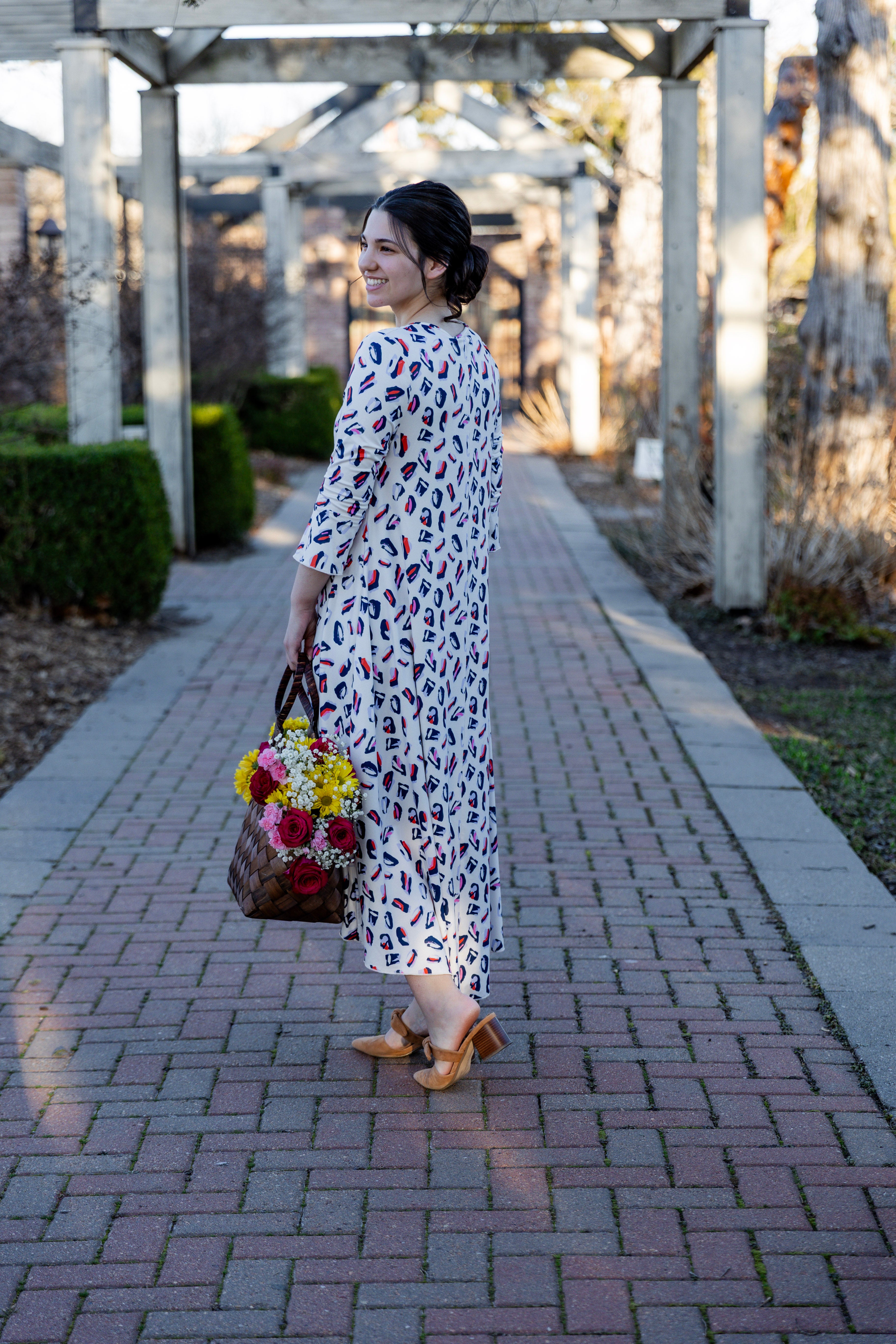 Modest high low knit dress with asymmetrical hem, ruffle sleeves, and mixed front prints – Kristine Dress by Nuggles®